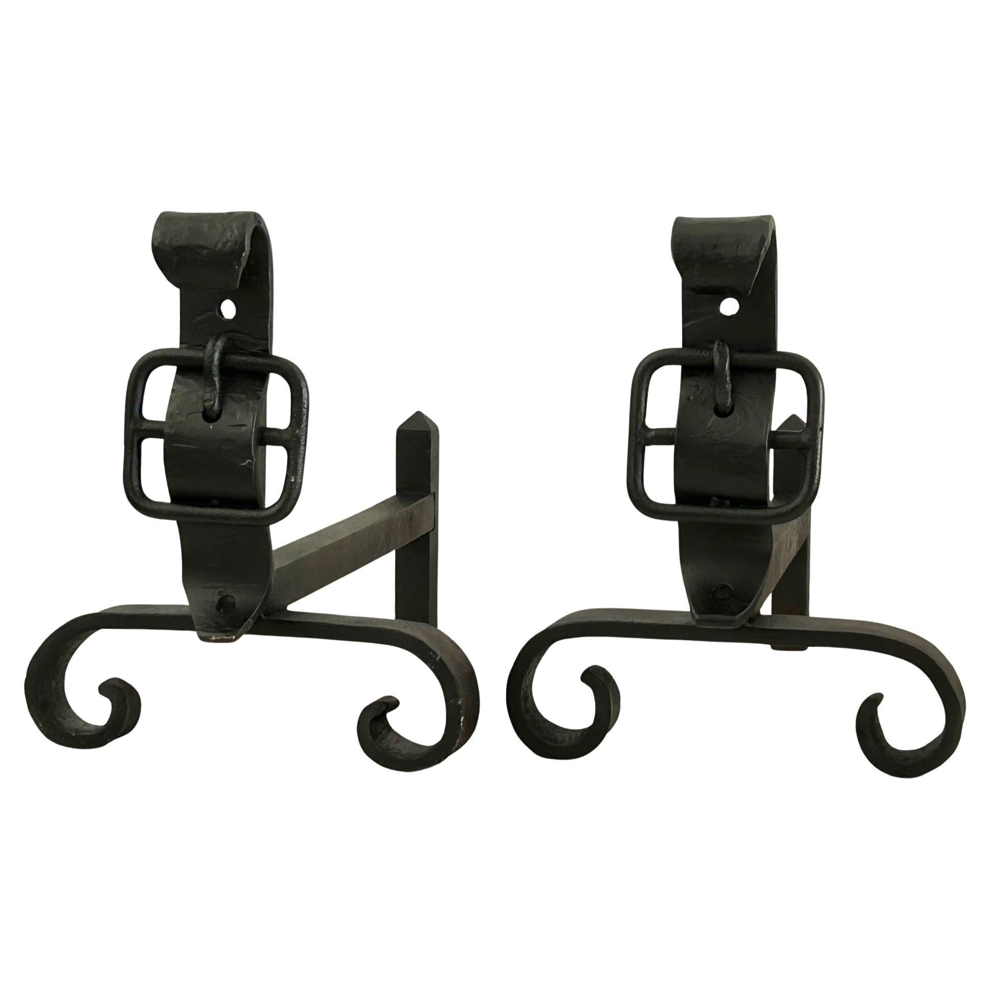 Pair of neo-classical wrought iron andirons dating from the 1950s