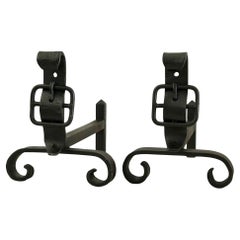 Pair of neo-classical wrought iron andirons dating from the 1950s