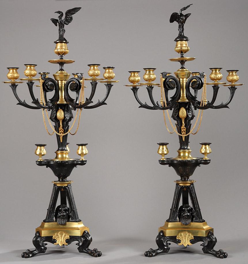 Rare pair of Greek style candelabras made in patinated bronze and gilded bronze, attributed to G. Servant. Each with ten light arms topped by a heron shaped extinguisher. Decorated with various Greek style motifs such palmets, pine cones ans water