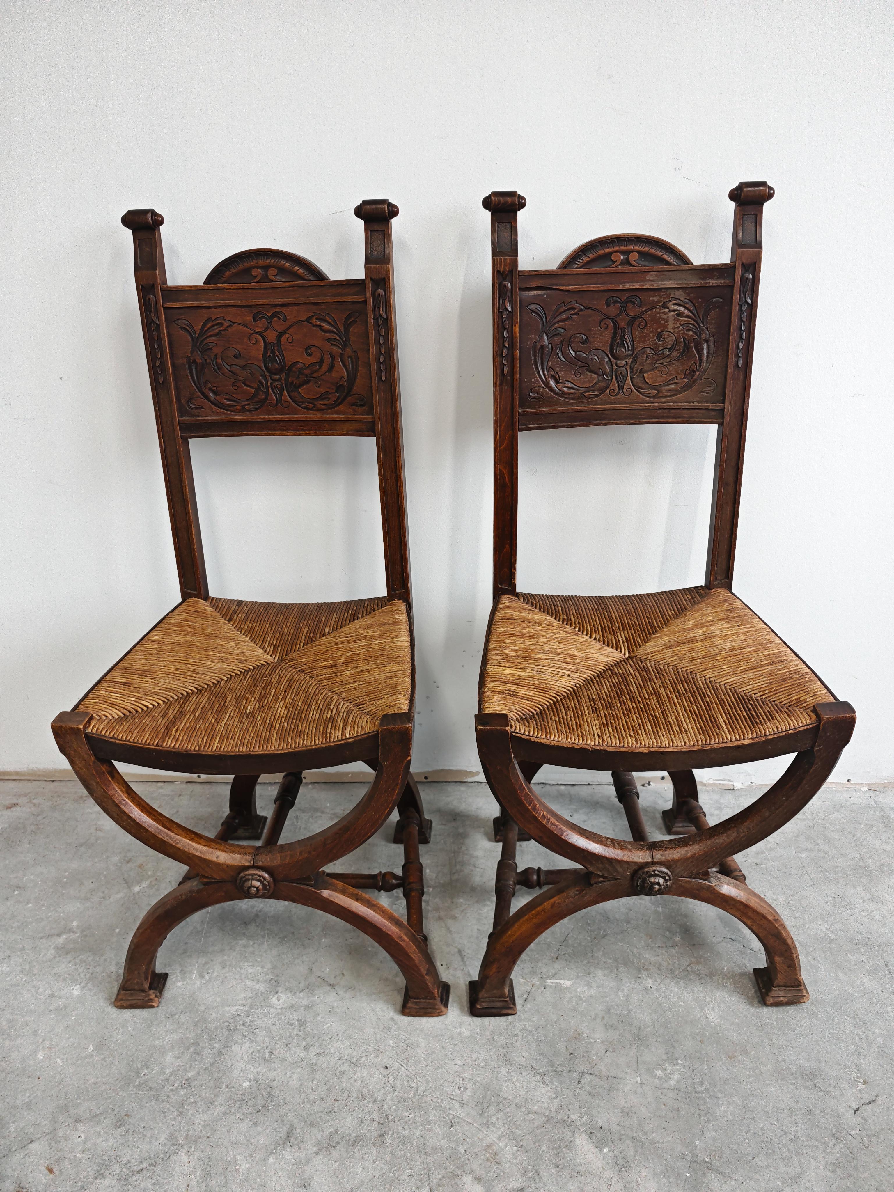 In this listing you will find a pair of unique Neo-renaissance side chairs done in solid walnut, with rush seats. The rustic, yet very sturdy and elegant design of the chairs makes these two beautiful chairs very truly striking. The chairs were made