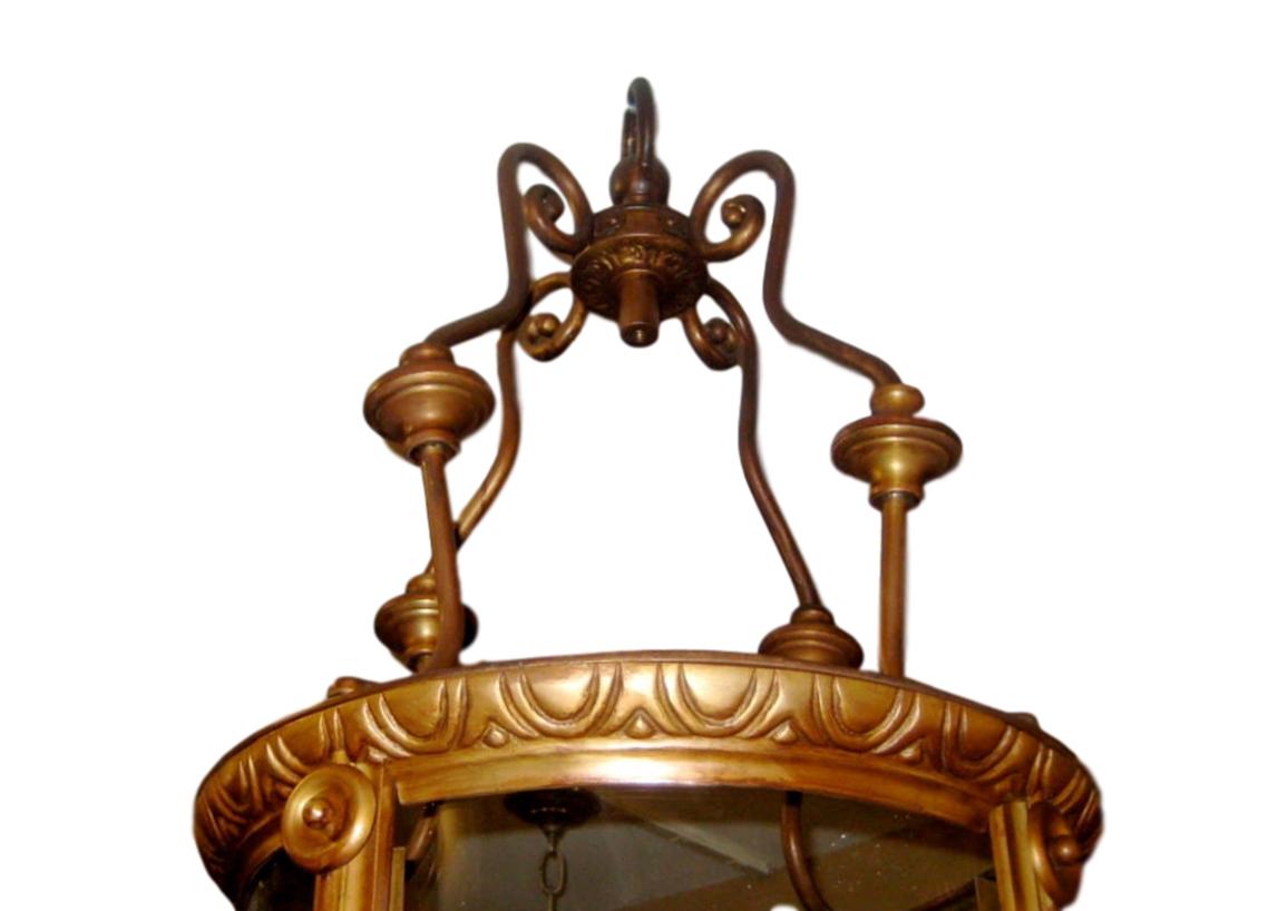 A pair of circa 1920s French neoclassic bronze lanterns with interior lights.

Measurements:
Minimum drop 46.5