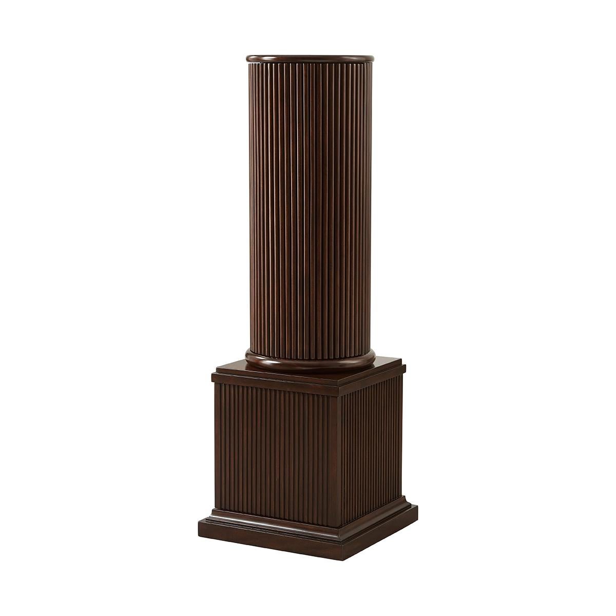 A pair of neoclassic style column-form pedestals with a reeded round top section, enclosing an interior with a single shelf and the lower squared section, fluted and also enclosing an interior with a single shelf. Can also be purchased