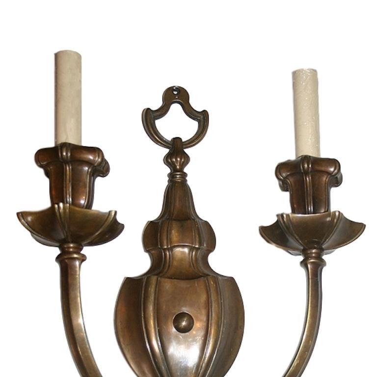 Patinated Pair of Neoclassic Style Caldwell Sconces For Sale