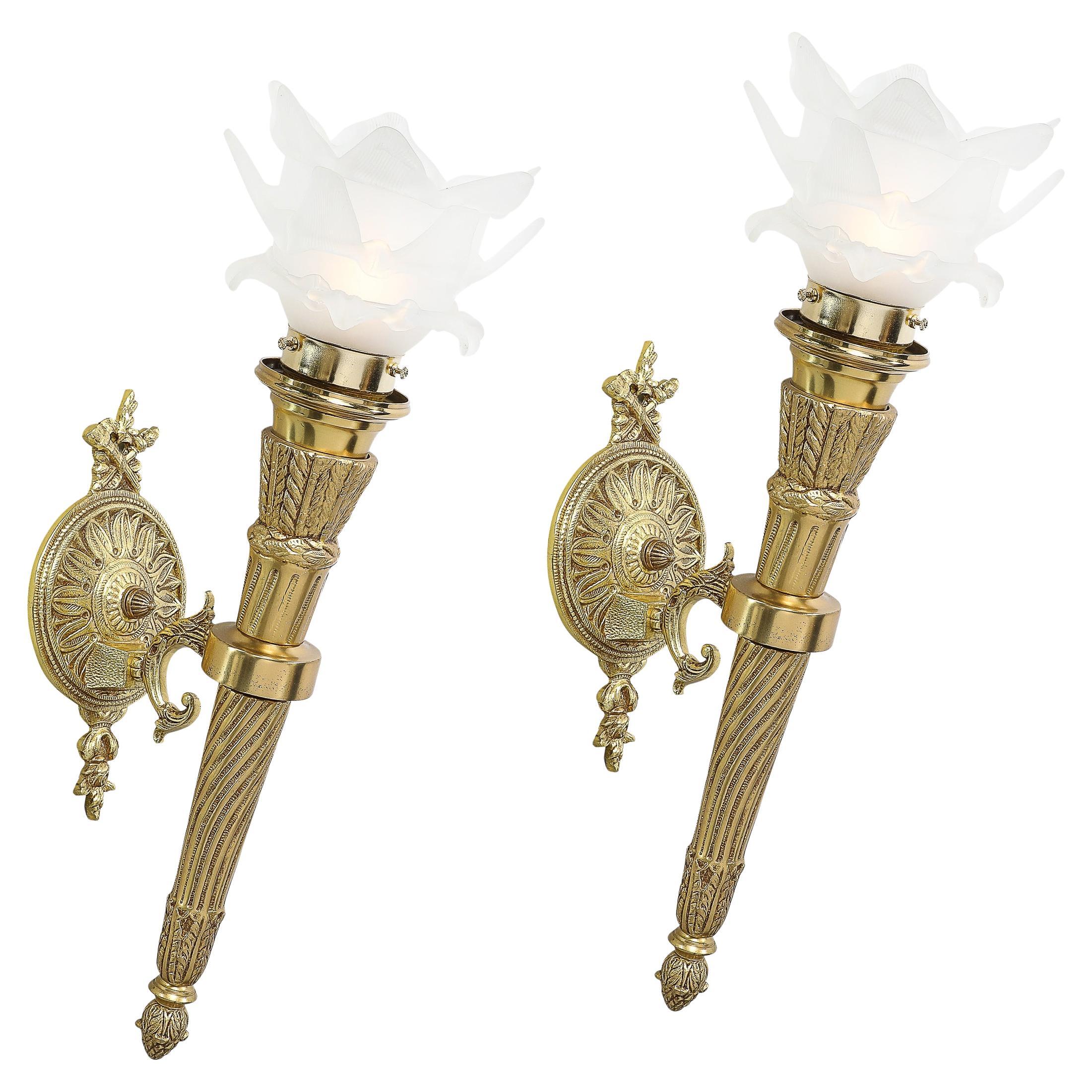 Pair of Neoclassical Antique Brass Torch Form Sconces with Frosted Glass Shades