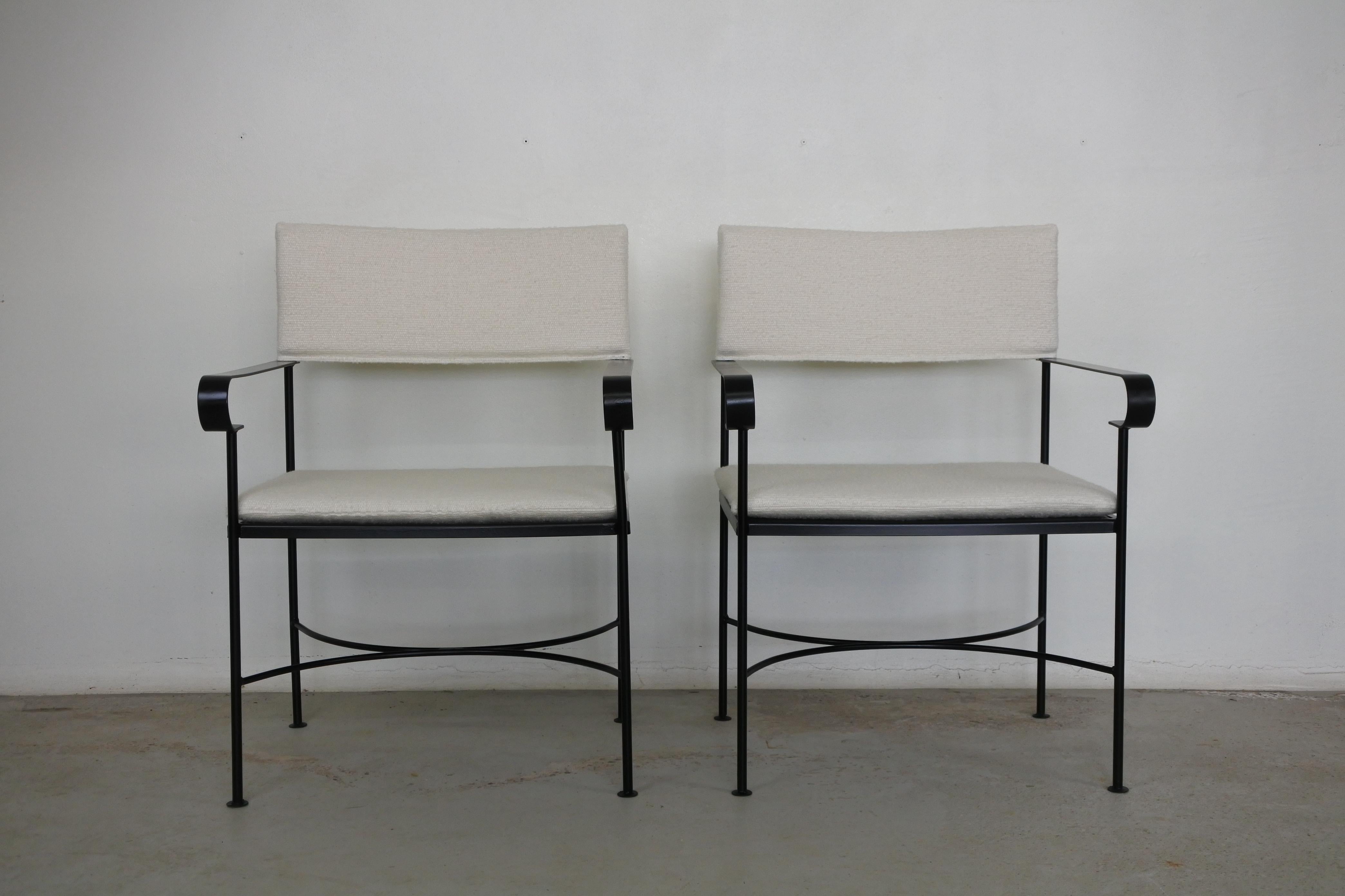 Pair of neoclassical armchairs.
Lacquered metal and fabric.
Made in France in the 1950s.

Reupholstered with a cream boucle fabric Pierre Frey (