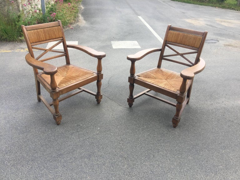 Pair of neoclassical armchairs in the style of André Arbus, circa 1940.
Good condition, a few lacks in the straw sits.