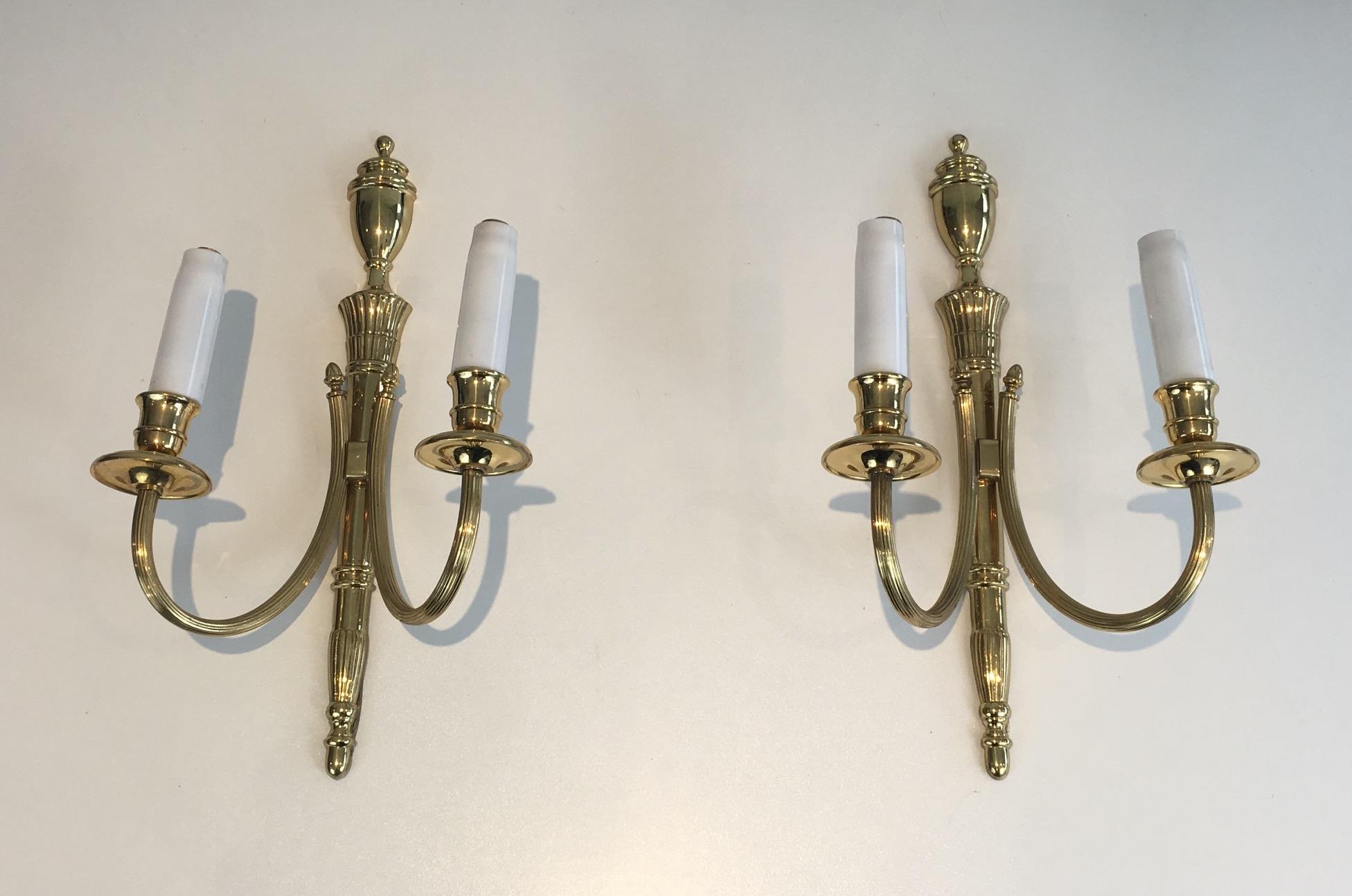 Pair of neoclassical brass sconces, French, circa 1970.