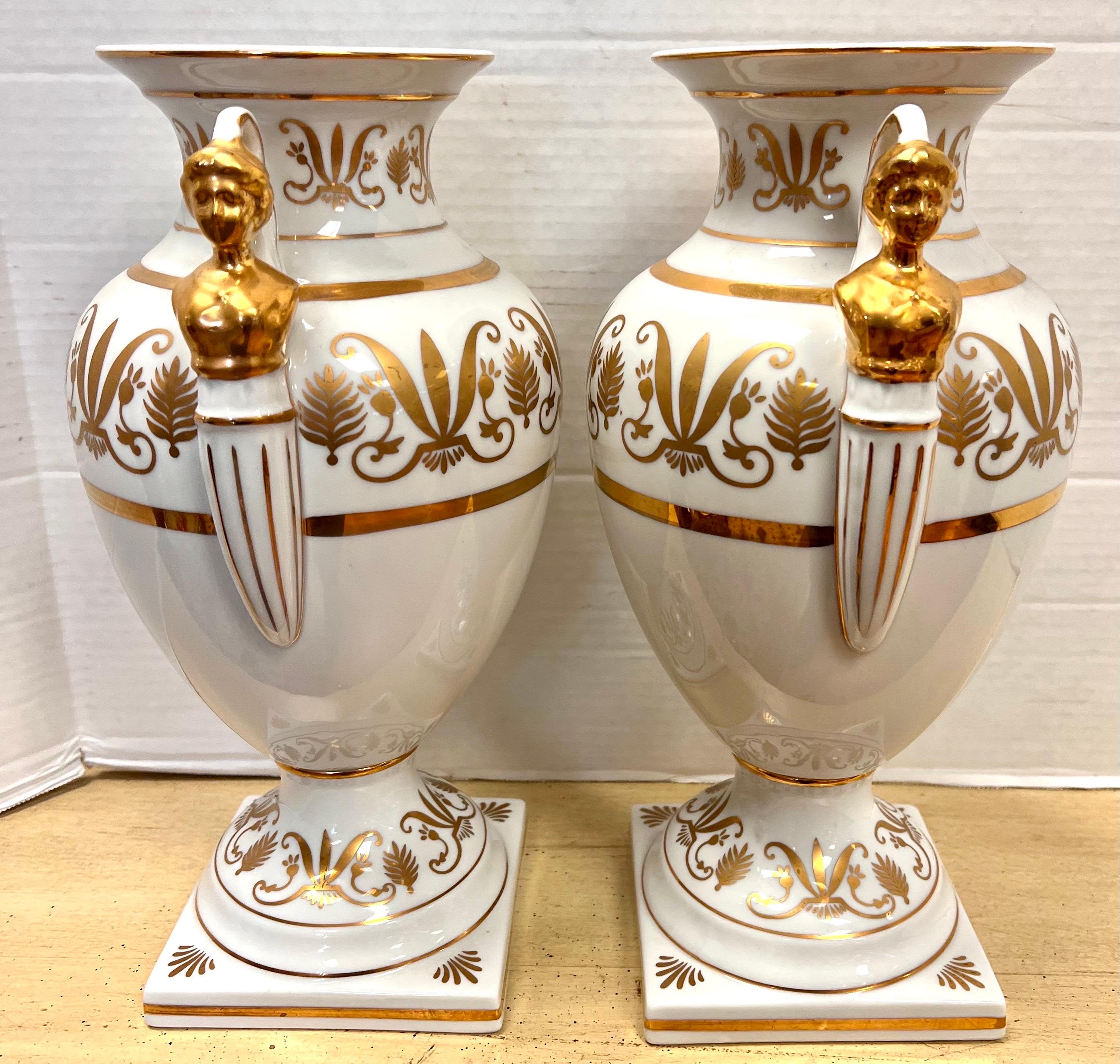 Pair of Neoclassical Campana Porcelain Gold and White Female Figural Urns 2