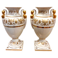 Pair of Neoclassical Campana Porcelain Gold and White Female Figural Urns
