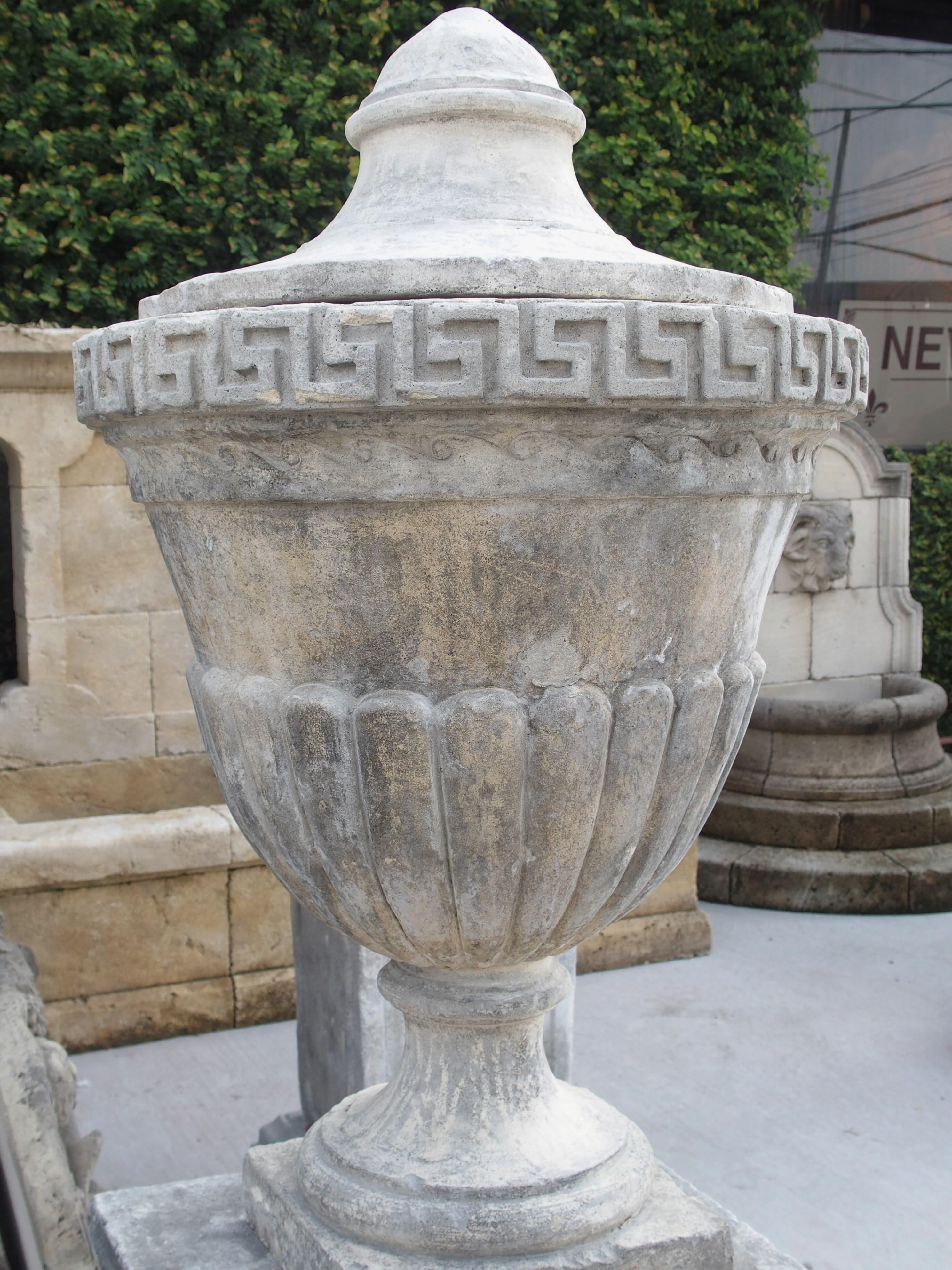 Italian Pair of Neoclassical Composition Limestone Urns on Pedestals, Southern Italy