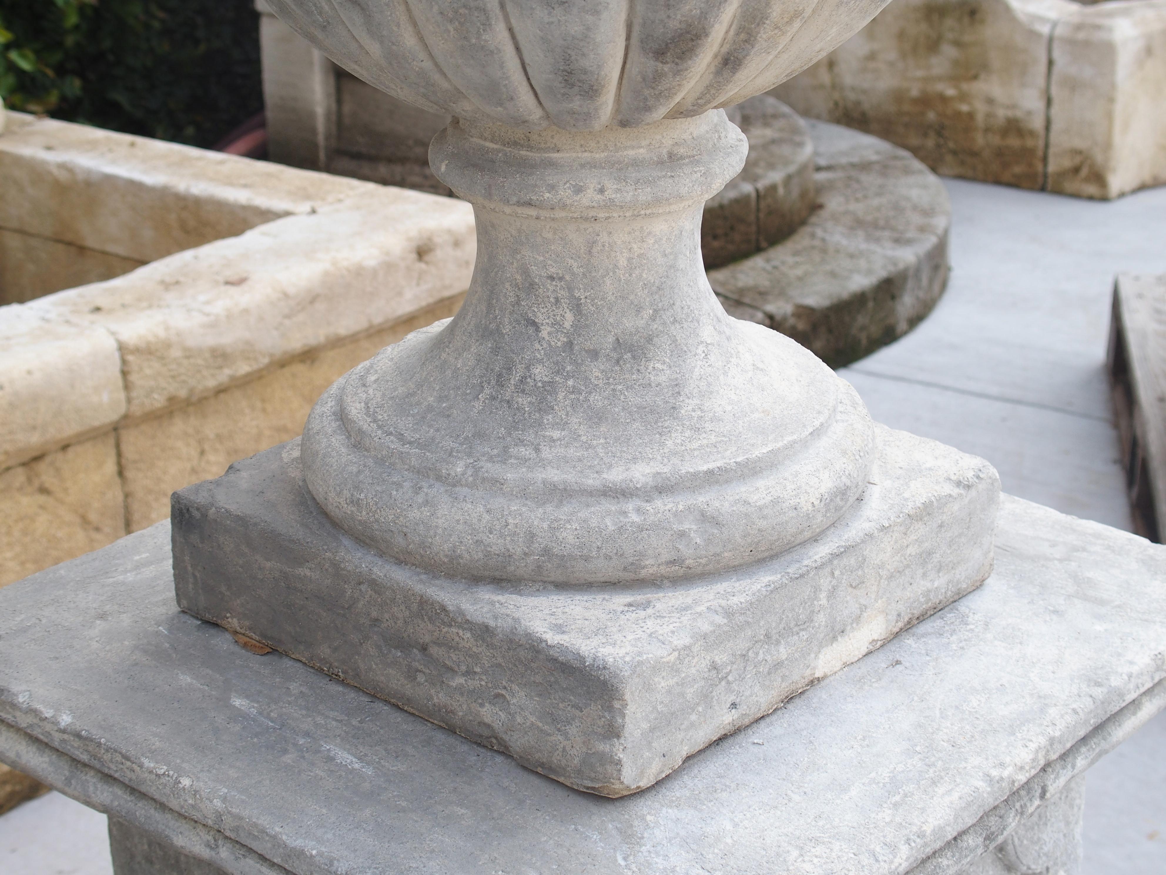 Contemporary Pair of Neoclassical Composition Limestone Urns on Pedestals, Southern Italy