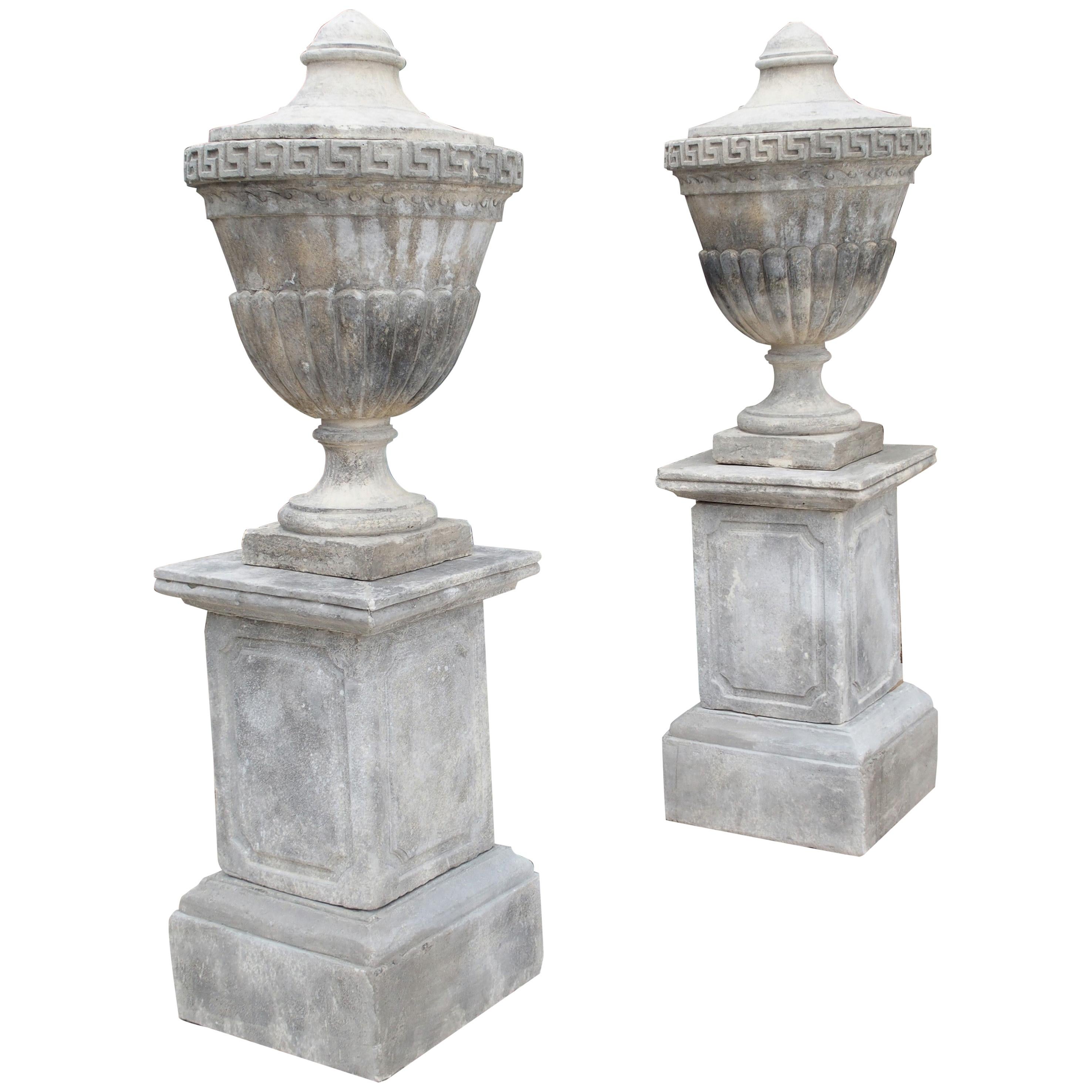Pair of Neoclassical Composition Limestone Urns on Pedestals, Southern Italy