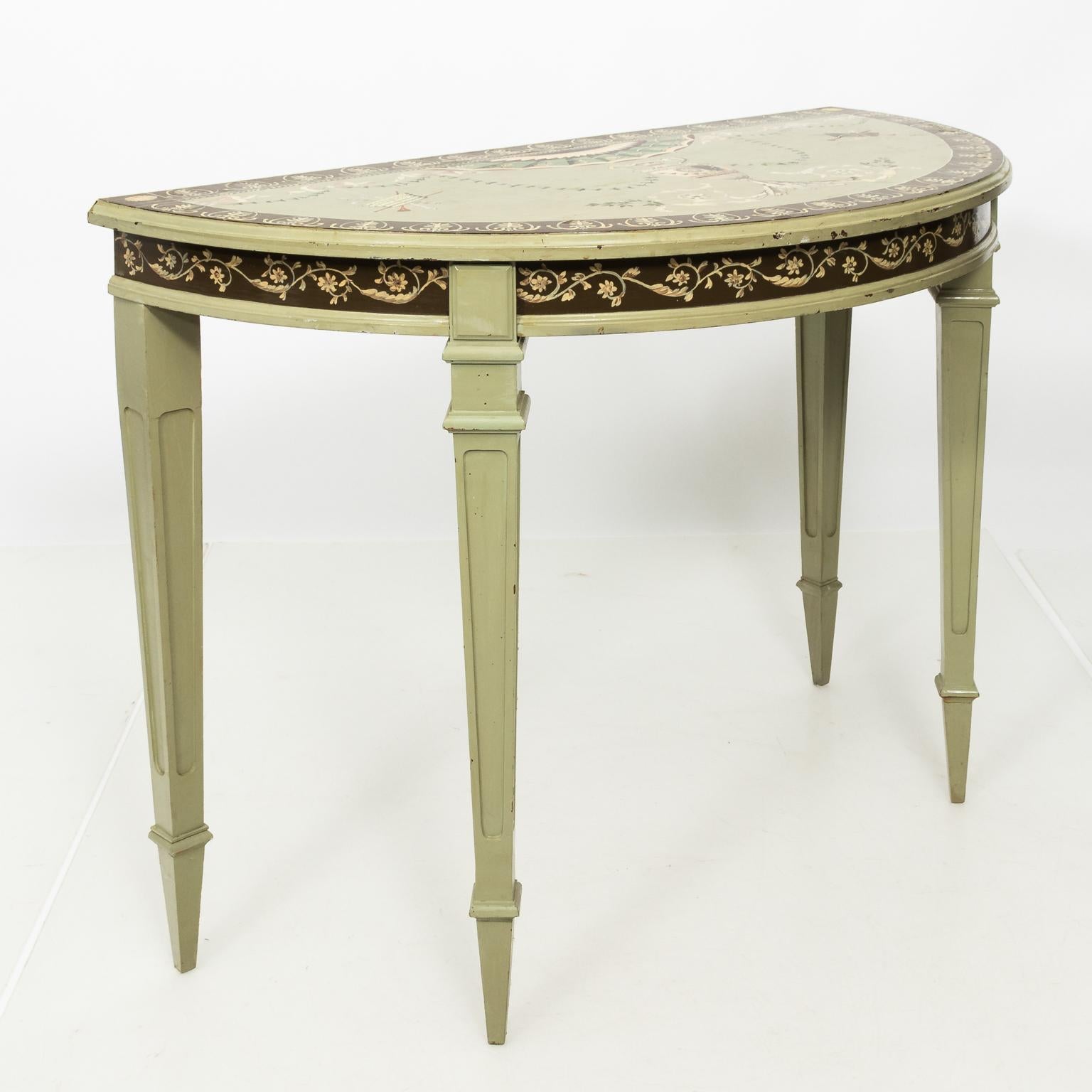 Neoclassical style painted demilune consoles with heavily detailed tabletop featuring delicately painted Adams style urns, Roman swags, palmettes, and painted musical instruments, circa 1930s. The skirt also features scrolled floral trim on tapered