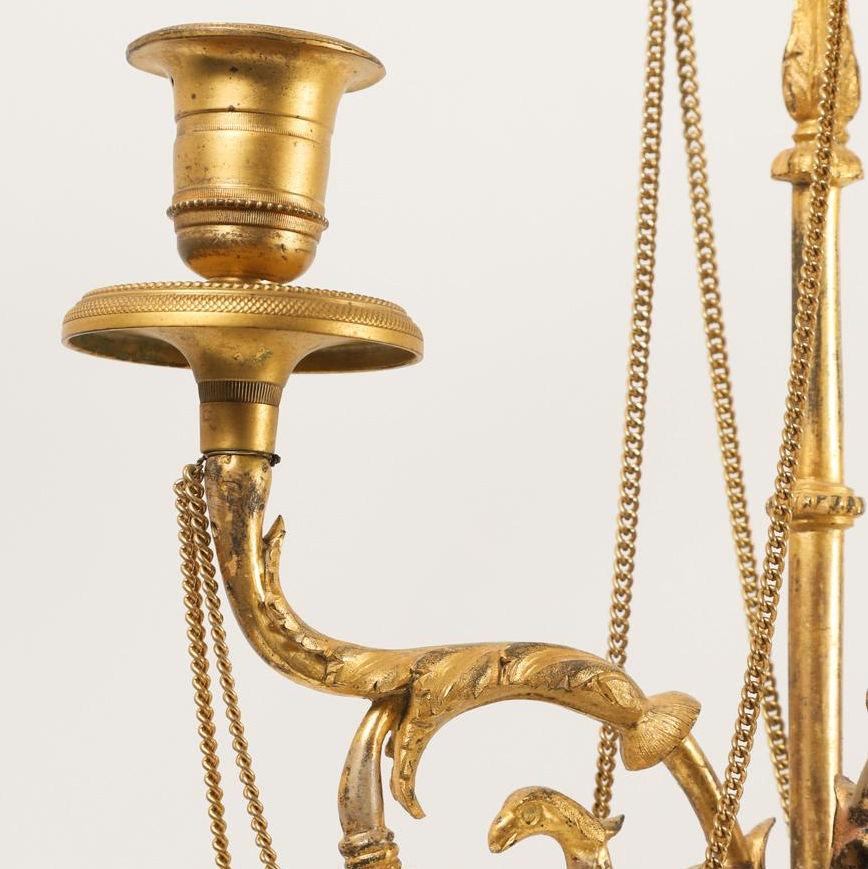 Pair of Neoclassical Directoire Gilt and Patinated Bronze Figural Candelabras In Good Condition For Sale In New York, NY