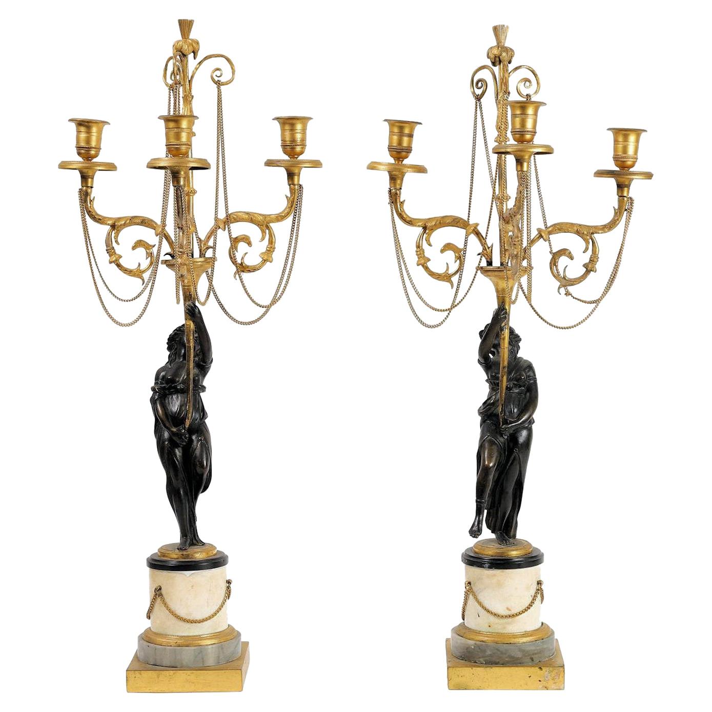 Pair of Neoclassical Directoire Gilt and Patinated Bronze Figural Candelabras For Sale