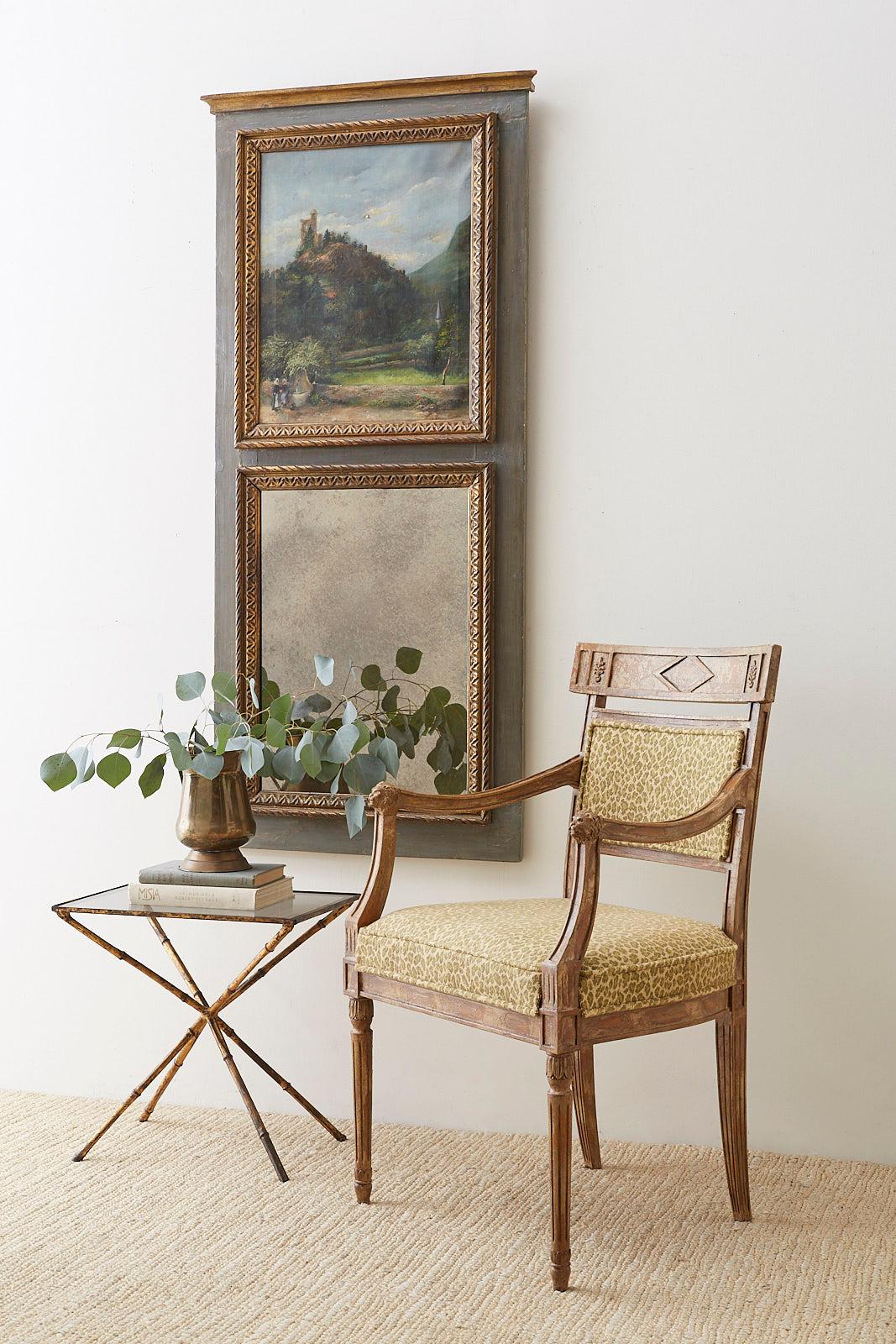 Fantastic pair of French fauteuils or armchairs made in the neoclassical Directoire taste. The ornately carved frames have molded arms with lions head motif ends. The distinctive back has a klismos style tablet form backrest with geometric designs