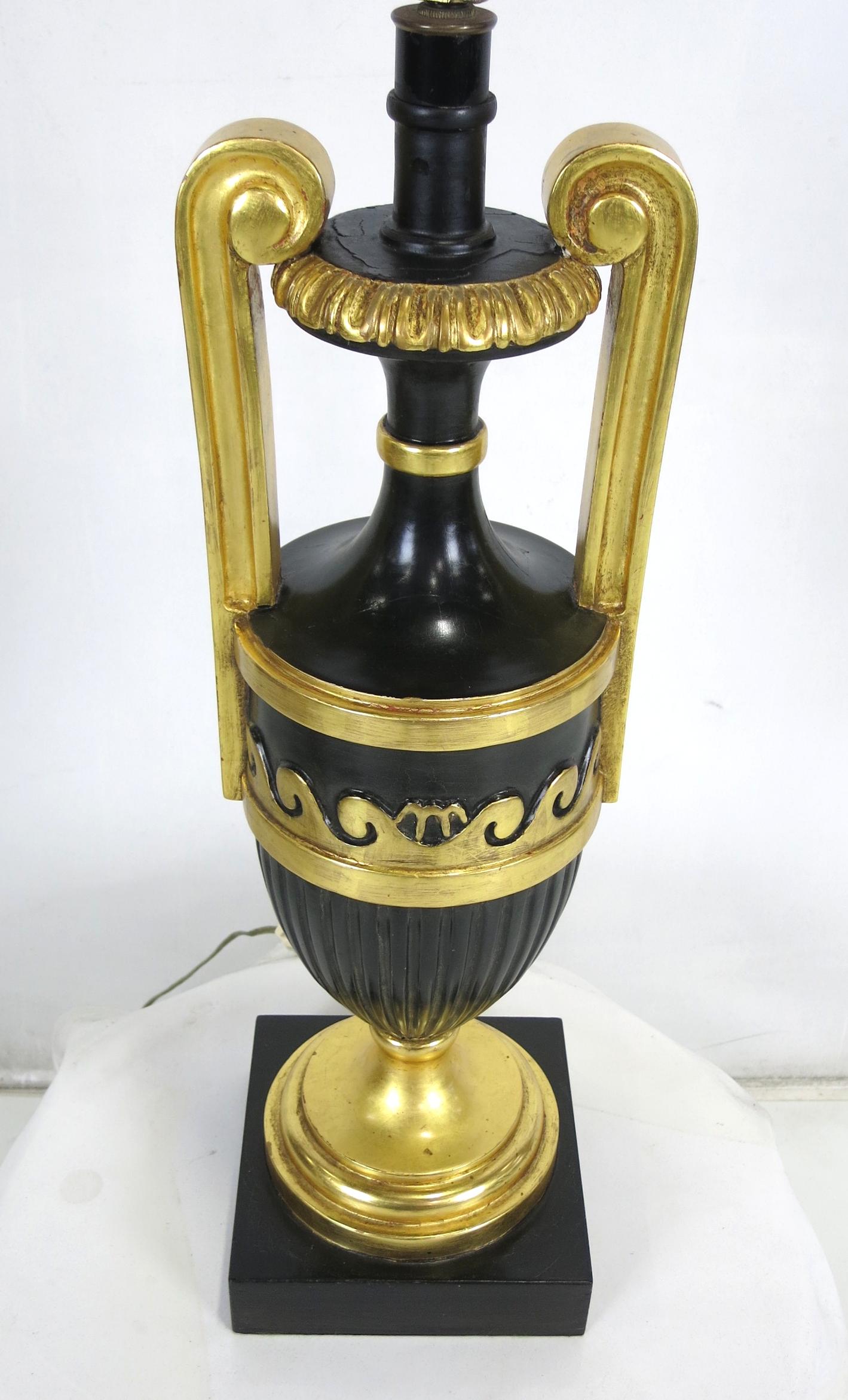 Exquisite pair of ebonized and giltwood table lamps by Marbro. The pair are beautifully carved and finished as expected from Marbro, the maker of the finest and most luxurious lamps ever.  Shades are for display only and are not included with the