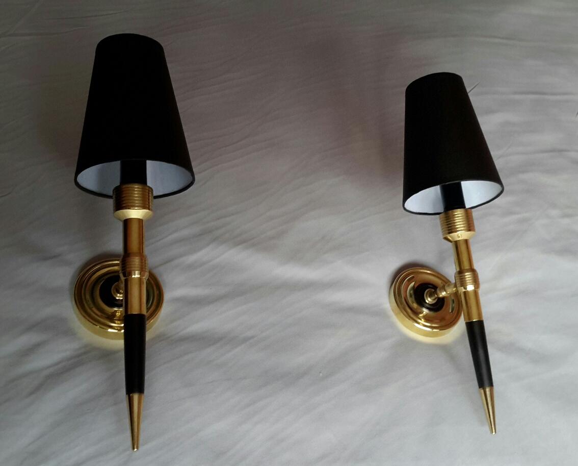 Gorgeous pair of french torchere sconces in gilded bronze, black painted wood and metal from the sixties by Maison Lancel
The electrical system has been renewed and comply with the US standard.The black cardboard lampshades are new.
The sconces