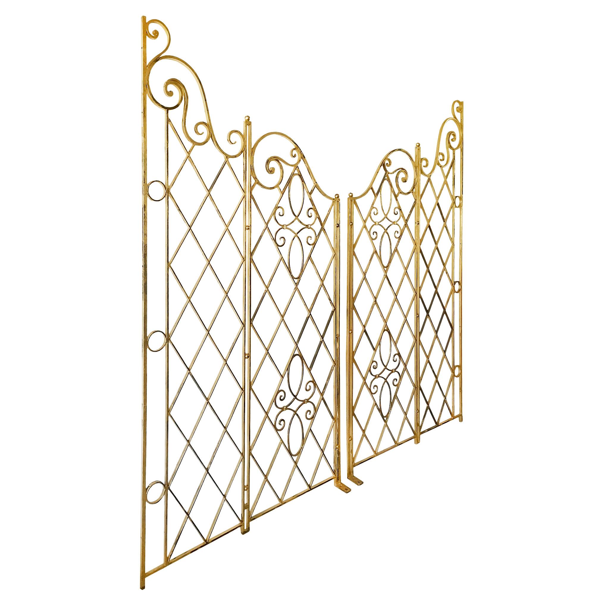 Pair of neoclassical apartment separation grilles in wrought iron with an old patina of gold leaf. Fixing points on the highest upright. Double sided. Very nice quality.
France c. 1940.

Dimensions (each)
cm: 105 x 1,5 x 142,5 (min.) – 200