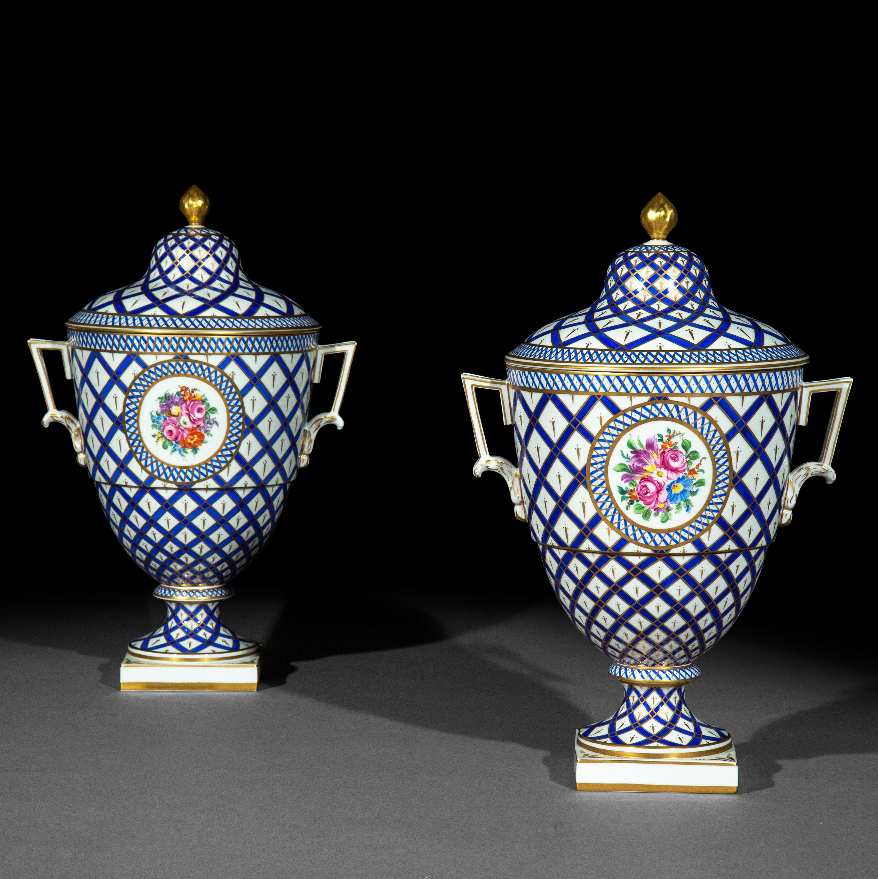 A superbly decorative pair of neoclassical lidded porcelain vases, exquisitely hand-painted in blue and white colours and gilded throughout.

Germany, early 20th century

We love the succulent colours and the intricacy of the miniature paintings.
   