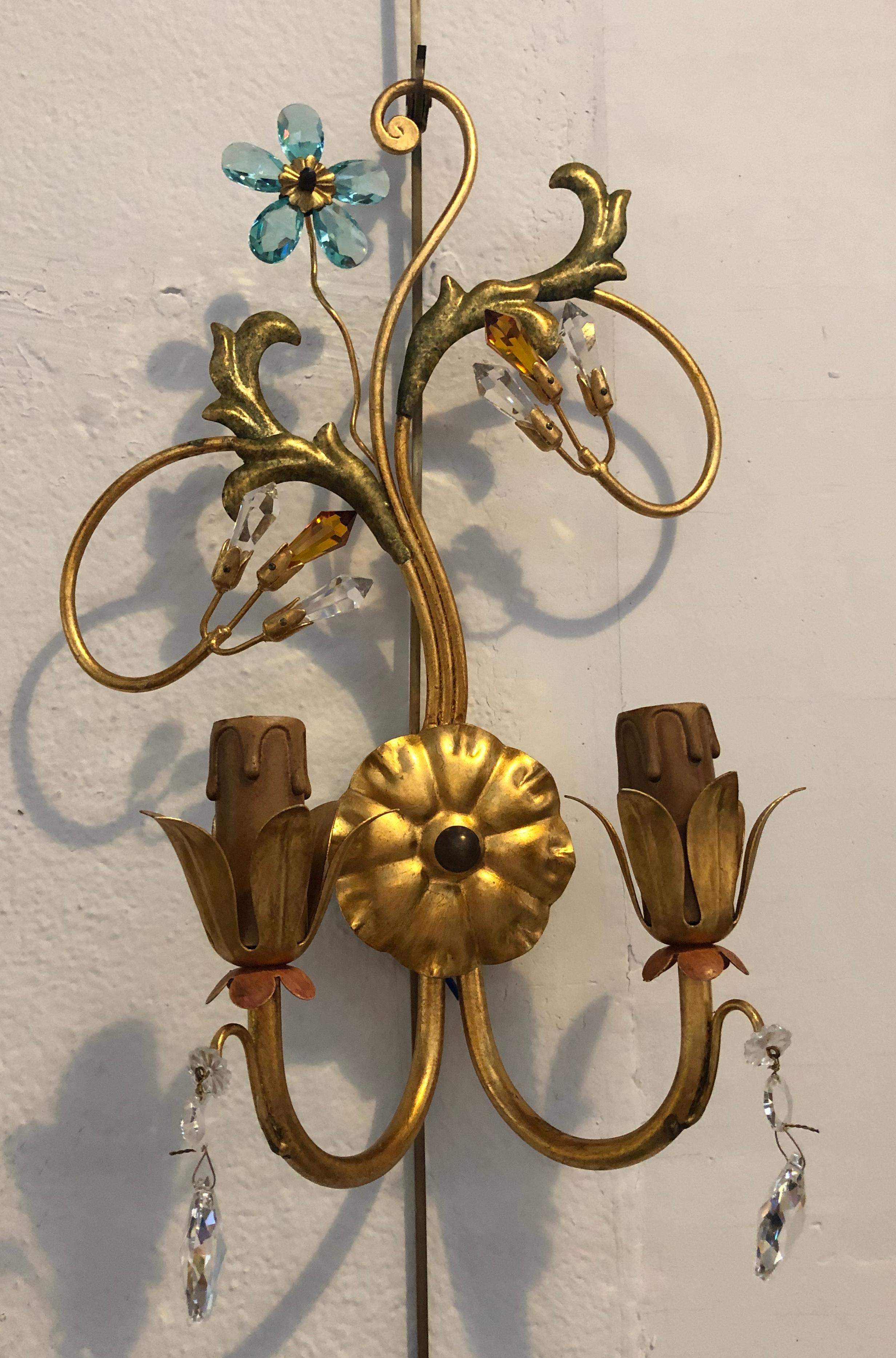 A pair of neoclassical handcrafted Italian gilt metal and crystal sconces by Alba Lamp Company.
Neoclassical handcrafted Italian gilt metal and crystal wall sconces having a matching Chandelier sold seperatly. This sleek and stylish murano crystal
