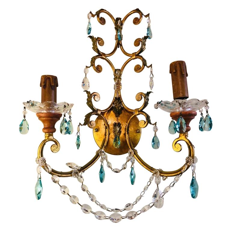 A pair of neoclassical handcrafted Italian gilt metal and crystal sconces
Neoclassical handcrafted Italian gilt metal and crystal wall sconces. This sleek and stylish Murano crystal pair of sconce is reminiscent of the workmanship that has made