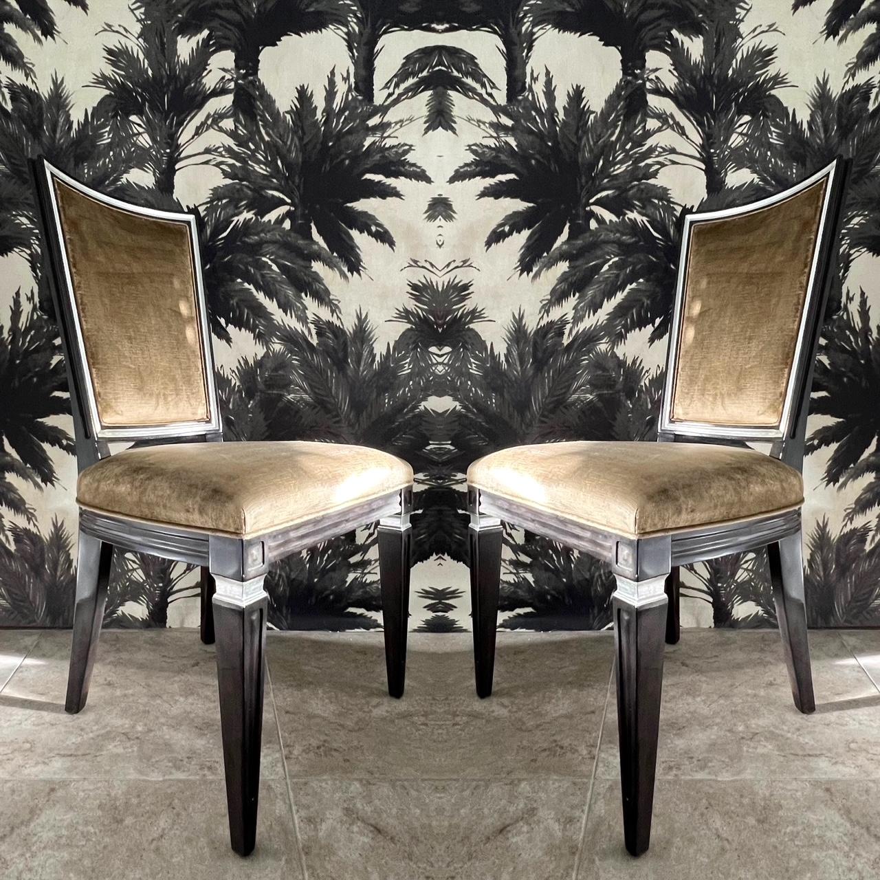 Pair of 1940's neoclassical Revival side chairs with elegant highback design. Upholstered in mushroom or taupe colored crushed velvet. The chairs have a Swedish Gustavian inspired design with carved notched frames with an ebonized finish and with