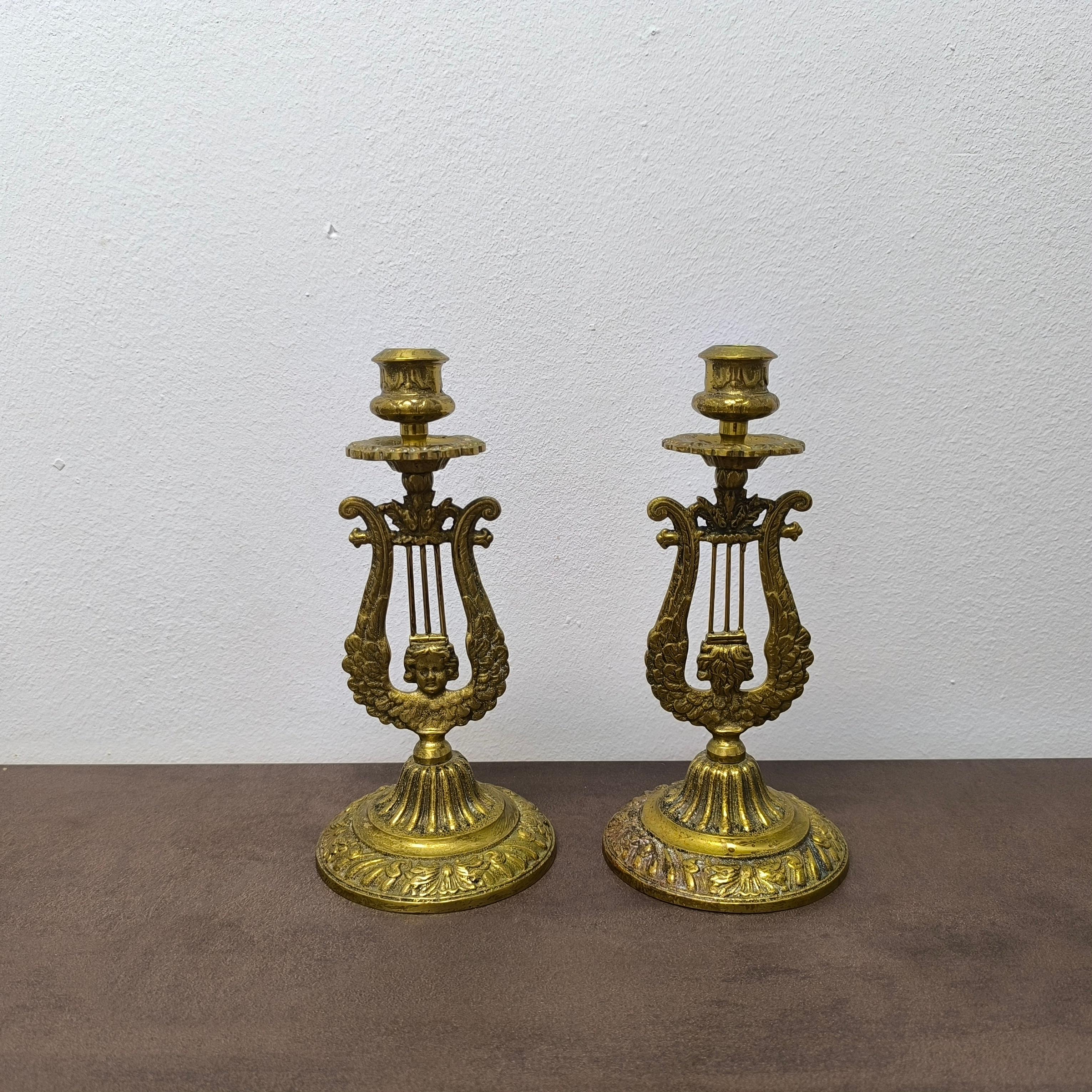 A poetic pair of early 20th-century Swedish candlesticks, crafted in solid brass by Gnosjö Hyltans Metall - renowned for its fine metalwork and sculptural precision. Designed in the form of classical lyres, these candlesticks evoke neoclassical