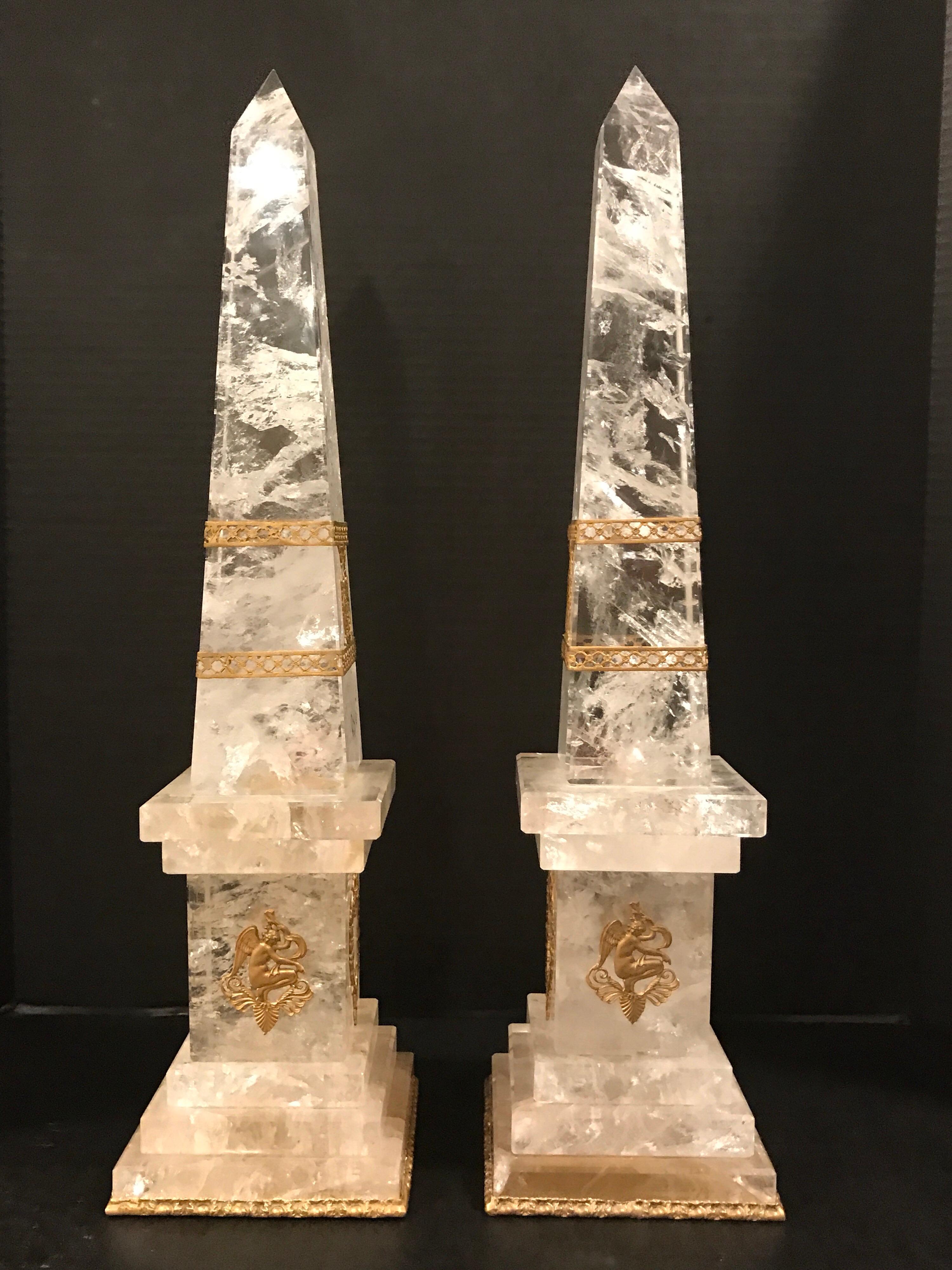 Pair of neoclassical rock crystal ormolu-mounted obelisks, each one of the finest specimen polished rock crystal, with delicate ormolu mounts.