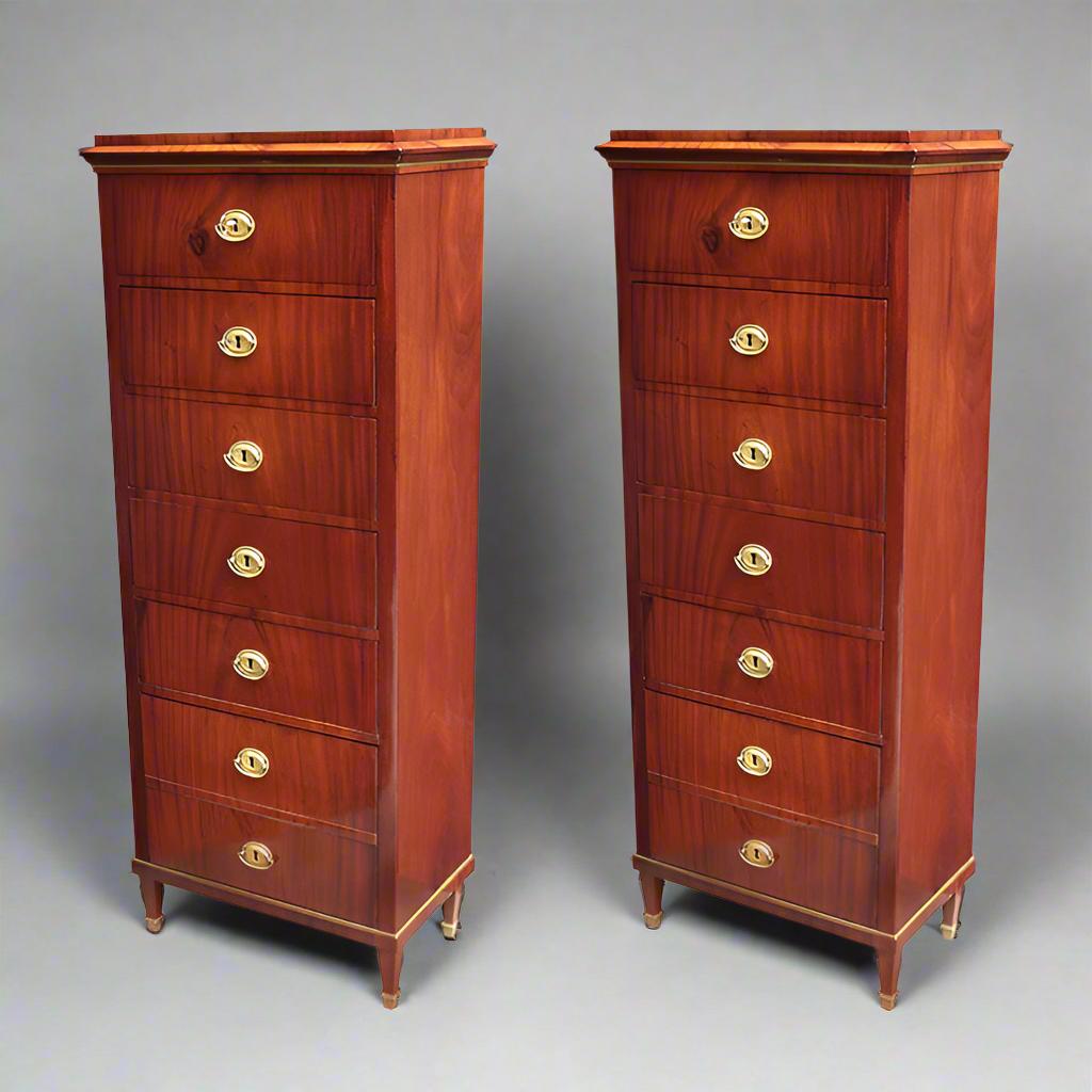 A pair of Neoclassical semainieres. Mahogany with patinated brass details.