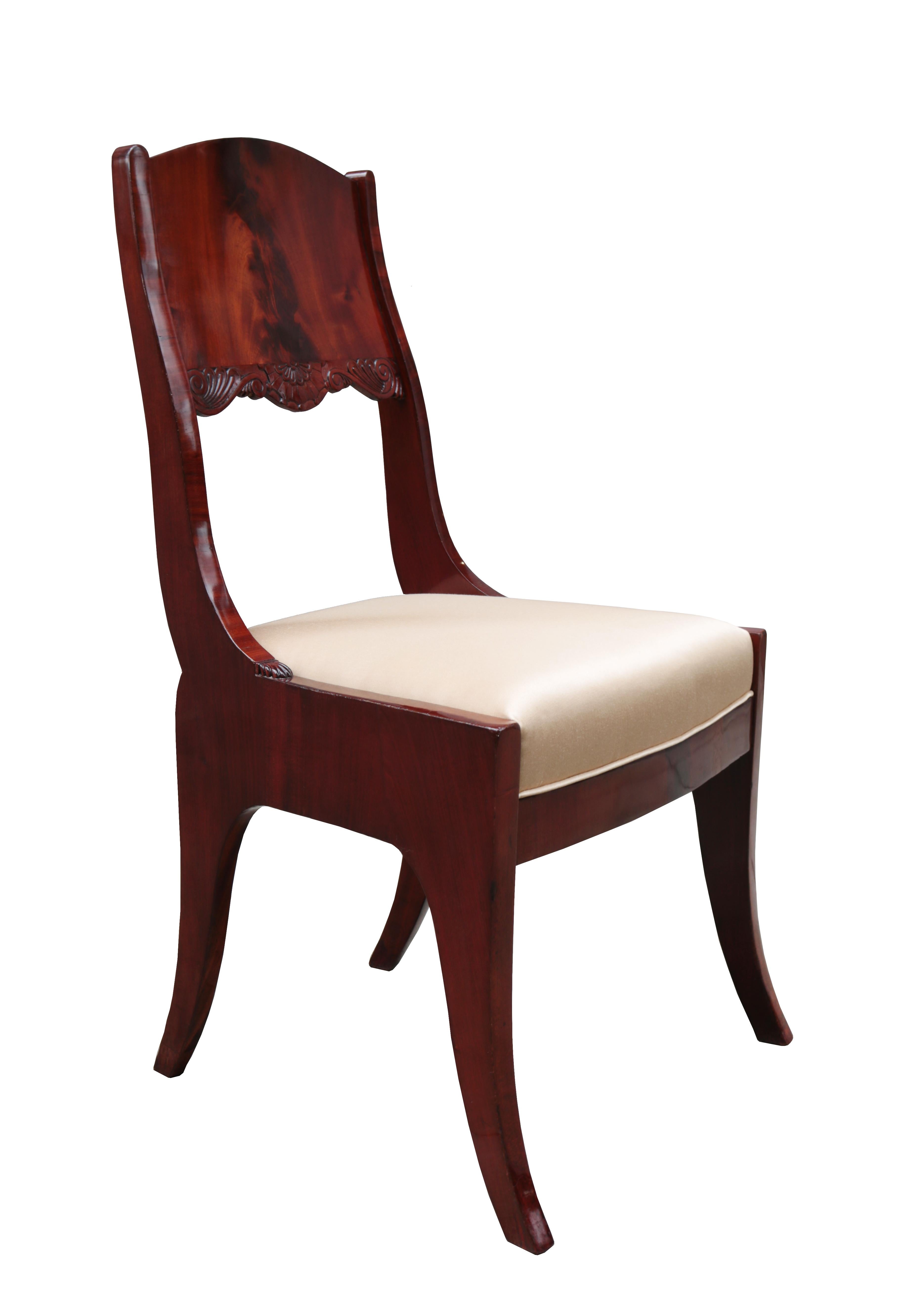 Pair of neoclassical side chairs.
Mahogany with carved details.