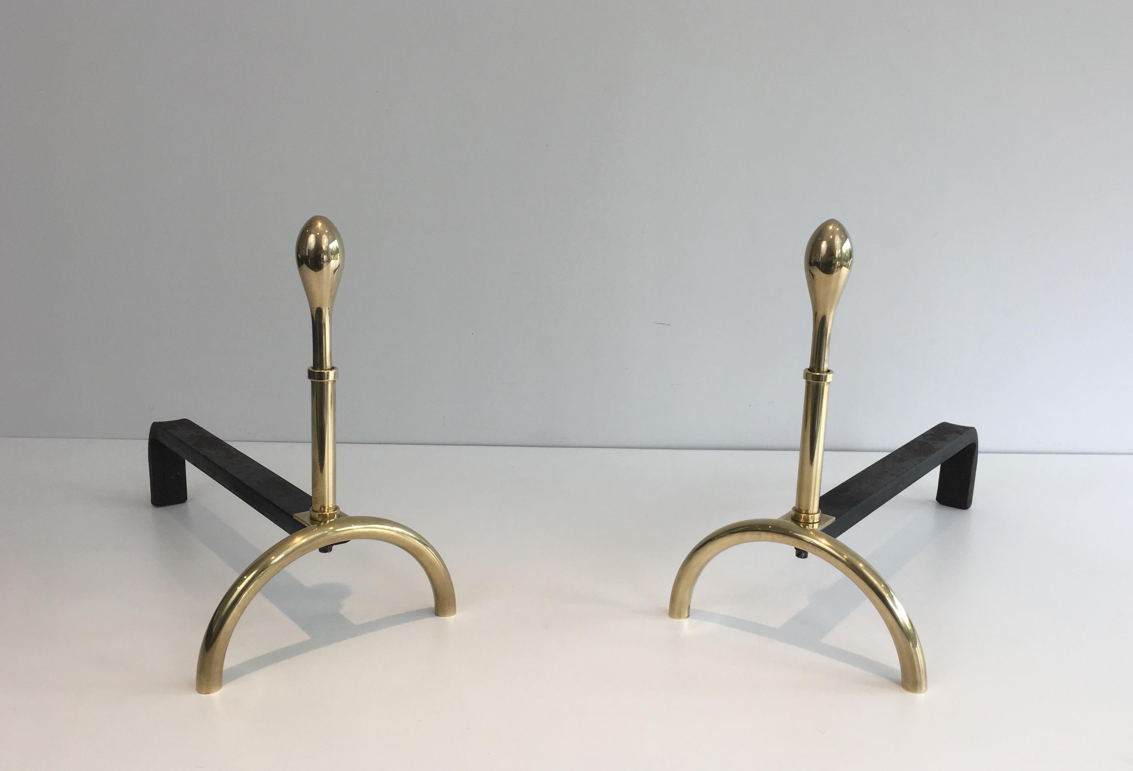 This beautiful pair of neoclassical style andirons are made of brass and iron. This is an interesting design, French work, circa 1970.