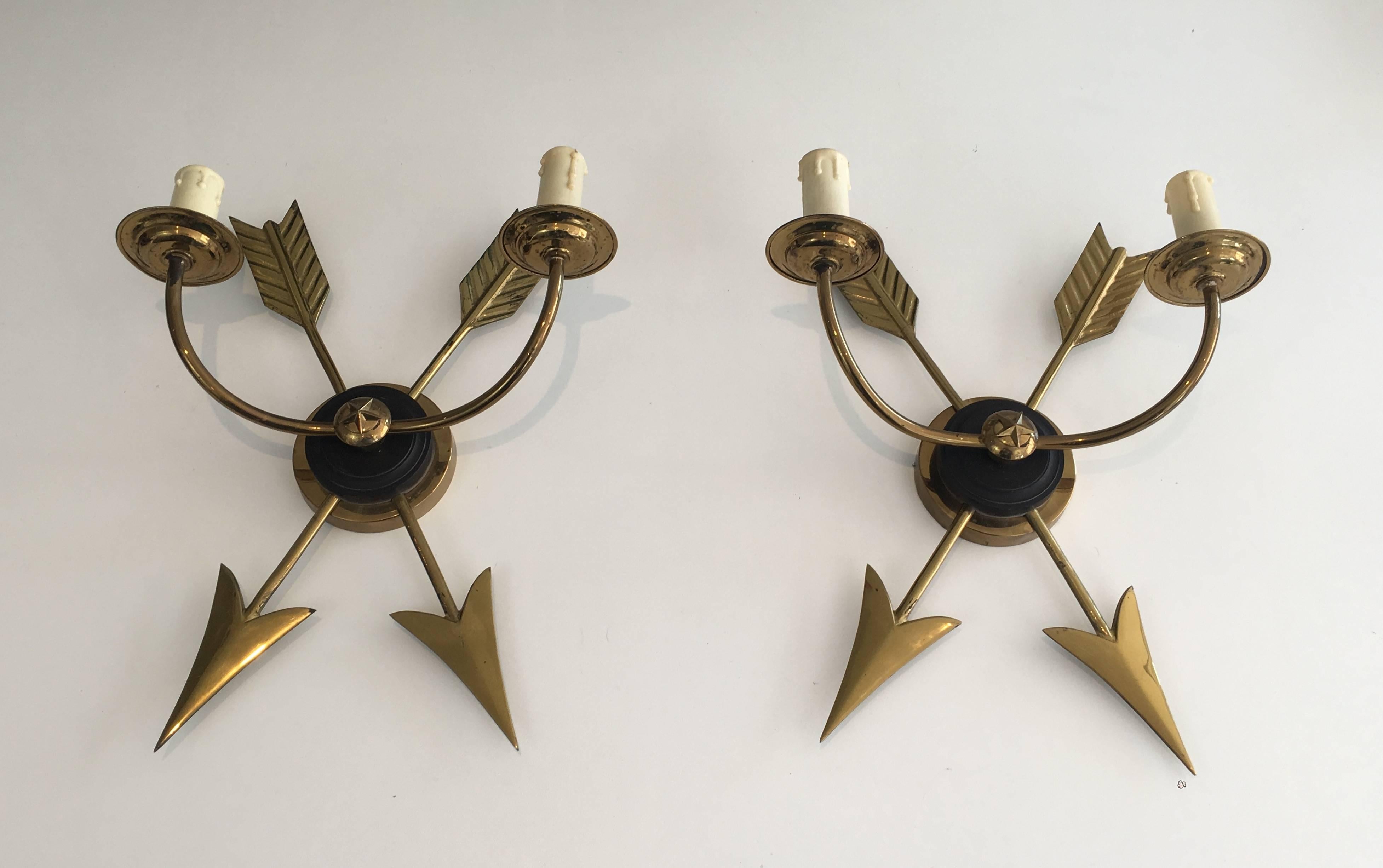 Pair of French neoclassical style brass sconces with double crossed arrows, circa 1960s

These sconces are currently in France, please allow 2 to 4 weeks for delivery to our warehouse in Long Island City, NY.

 