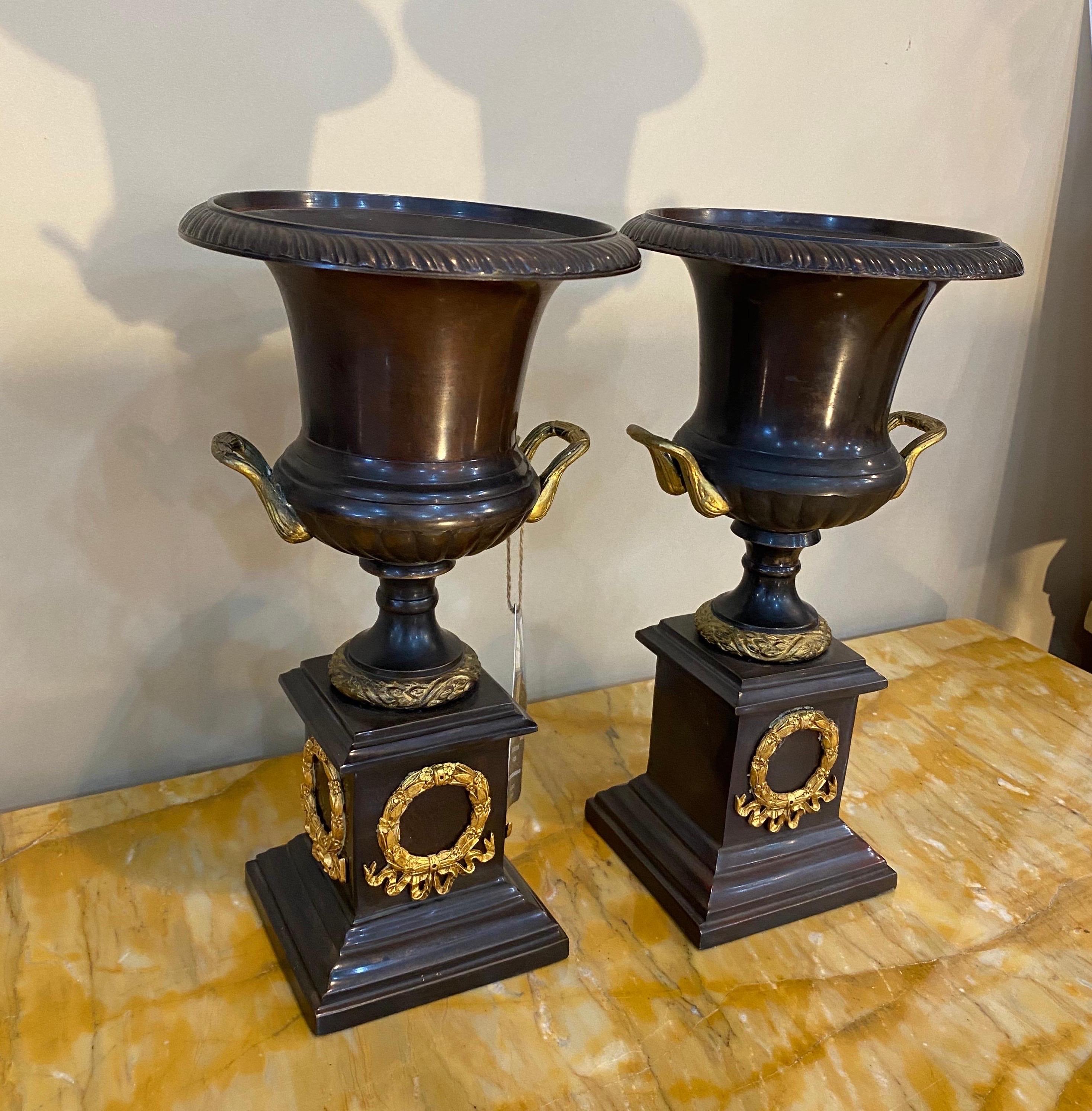 Pair of neoclassical style bronze urns. Great castings and mounts.