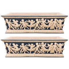 Pair of Neoclassical Style Ceramic Planter Tops Depicting Cherubs Dancing