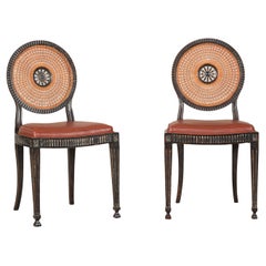 Pair of Neoclassical Style Dining Chairs with Leather Seats and Rattan Backs