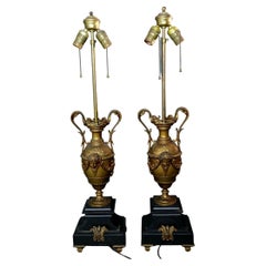 Pair of Neoclassical-Style Gilt-Bronze Urns Lamps on Black Marble Bases