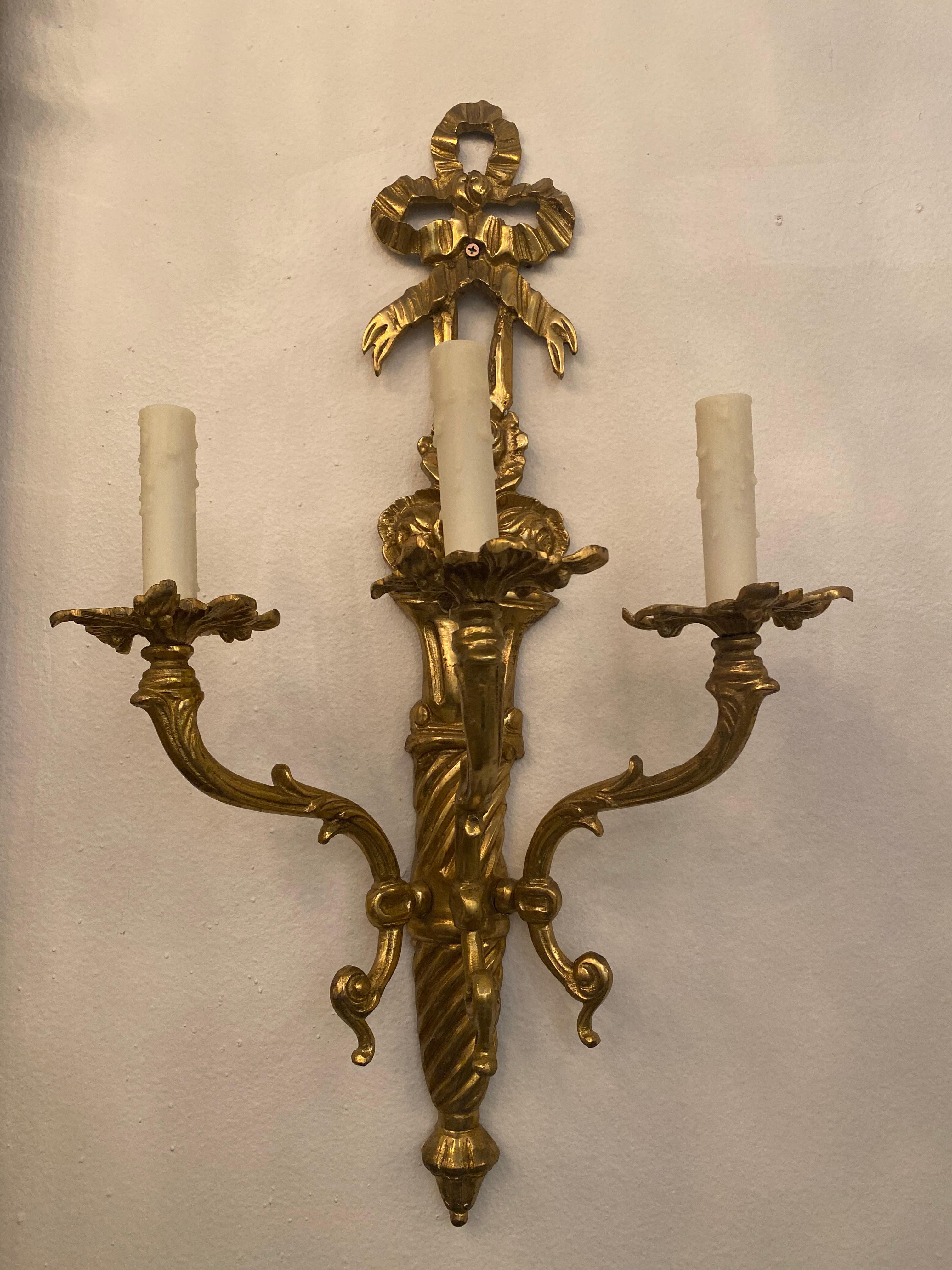 Neoclassic style gilt gold wall sconces, one pair 3 lights each in excellent conditions, from 19th century.