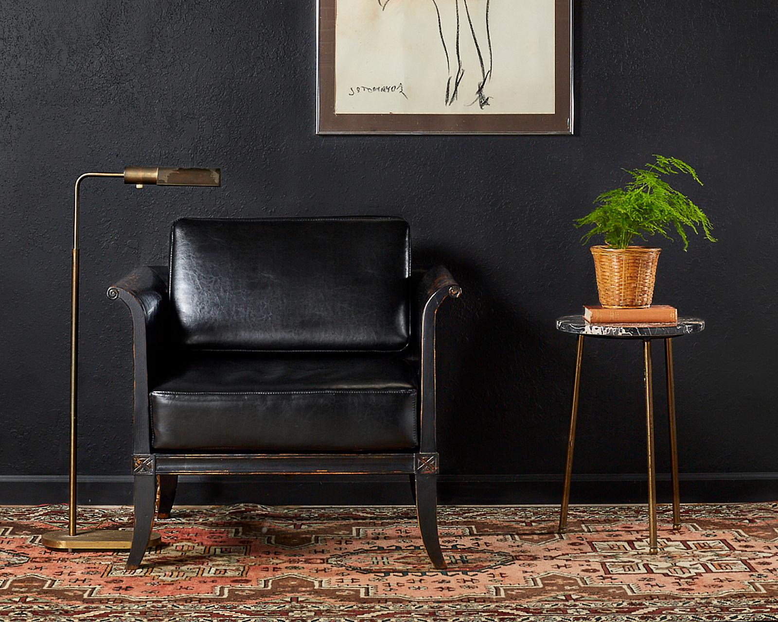 Dramatic pair of oak lacquered cube chairs, or tub chairs made in the neoclassical taste. The lounge chairs feature an intentionally distressed black lacquer finish with a low sleek profile. The arms and back have scrolled ends and the seat is