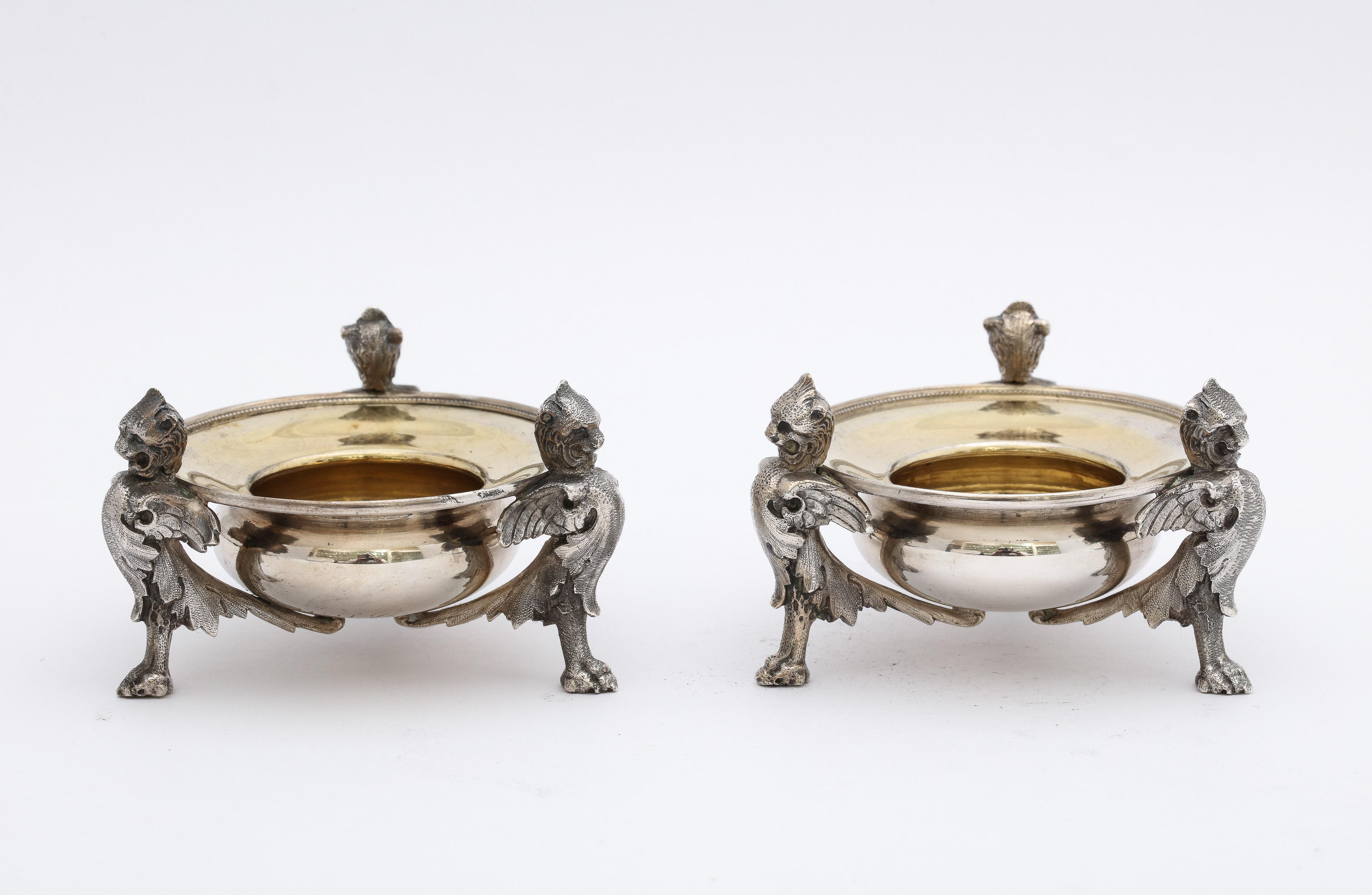 Pair of Neoclassical Style, parcel-gilt, Coin Silver (.900) footed salt cellars, American, Ca. 1850's (underside of each salt cellar is lightly engraved with  script initials - NSG - and the date 1859). The maker's mark for Gorham Mfg. Co. (located
