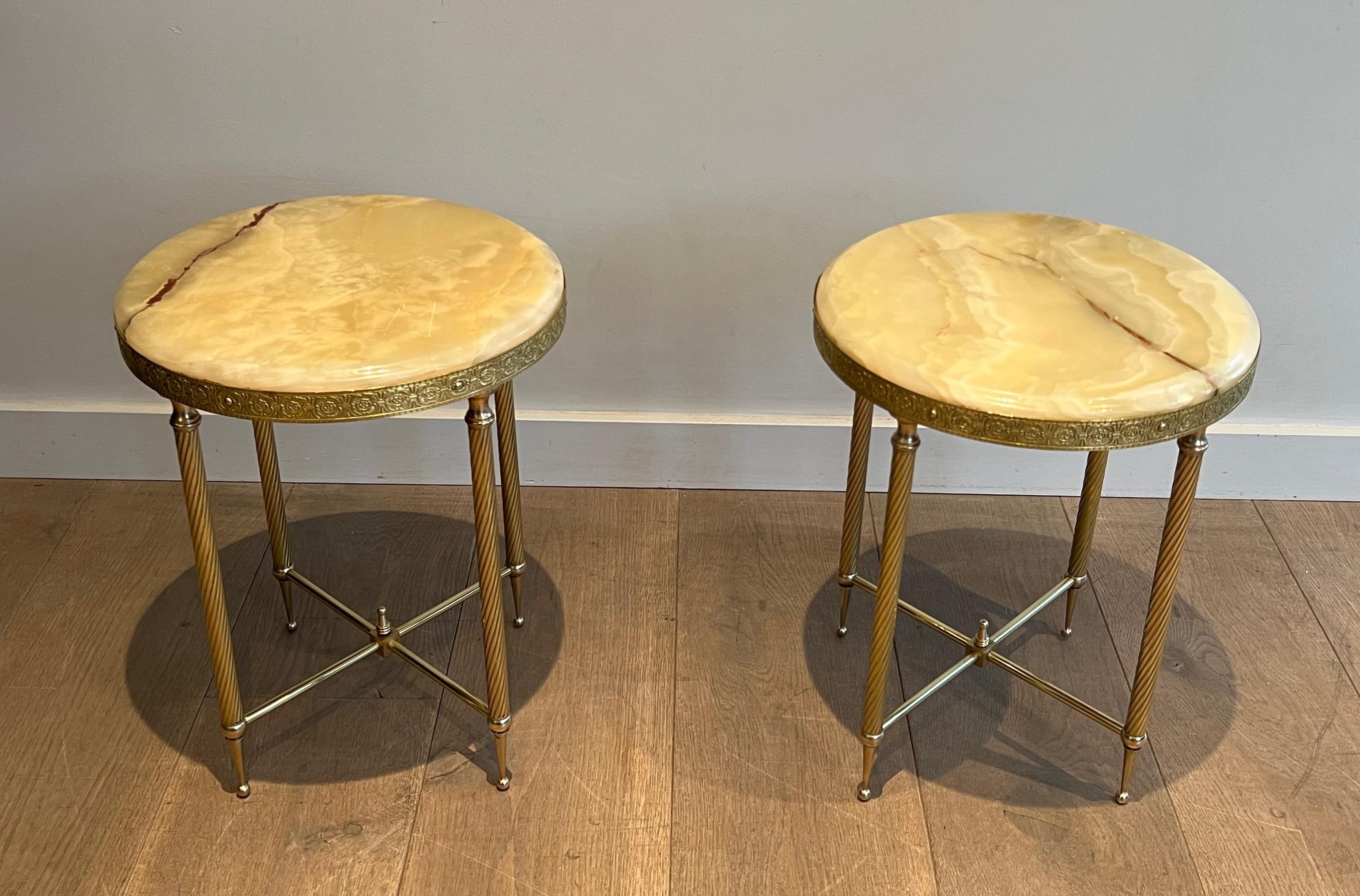 This beautiful pair of neoclassical style round side tables is made of brass with Onyx tops. 