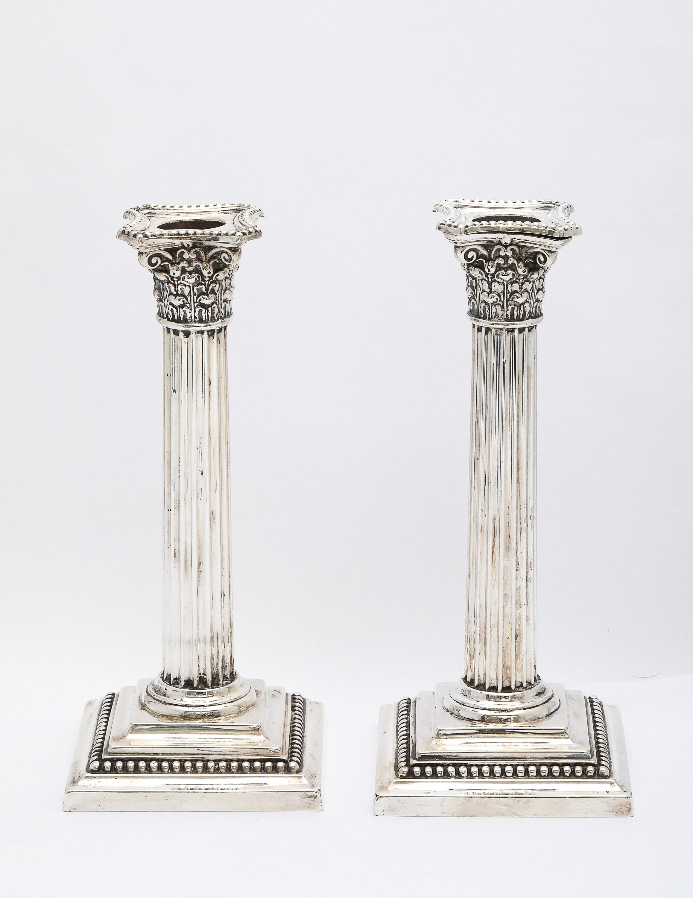 Pair of Neoclassical-Style, sterling silver Corinthian column candlesticks, Gorham Manufacturing Company, Providence, Rhode Island, Ca 1915. Each candlestick measures almost 7 1/2 inches high x 3 1/4 inches wide (at widest point across base) x 3 1/4