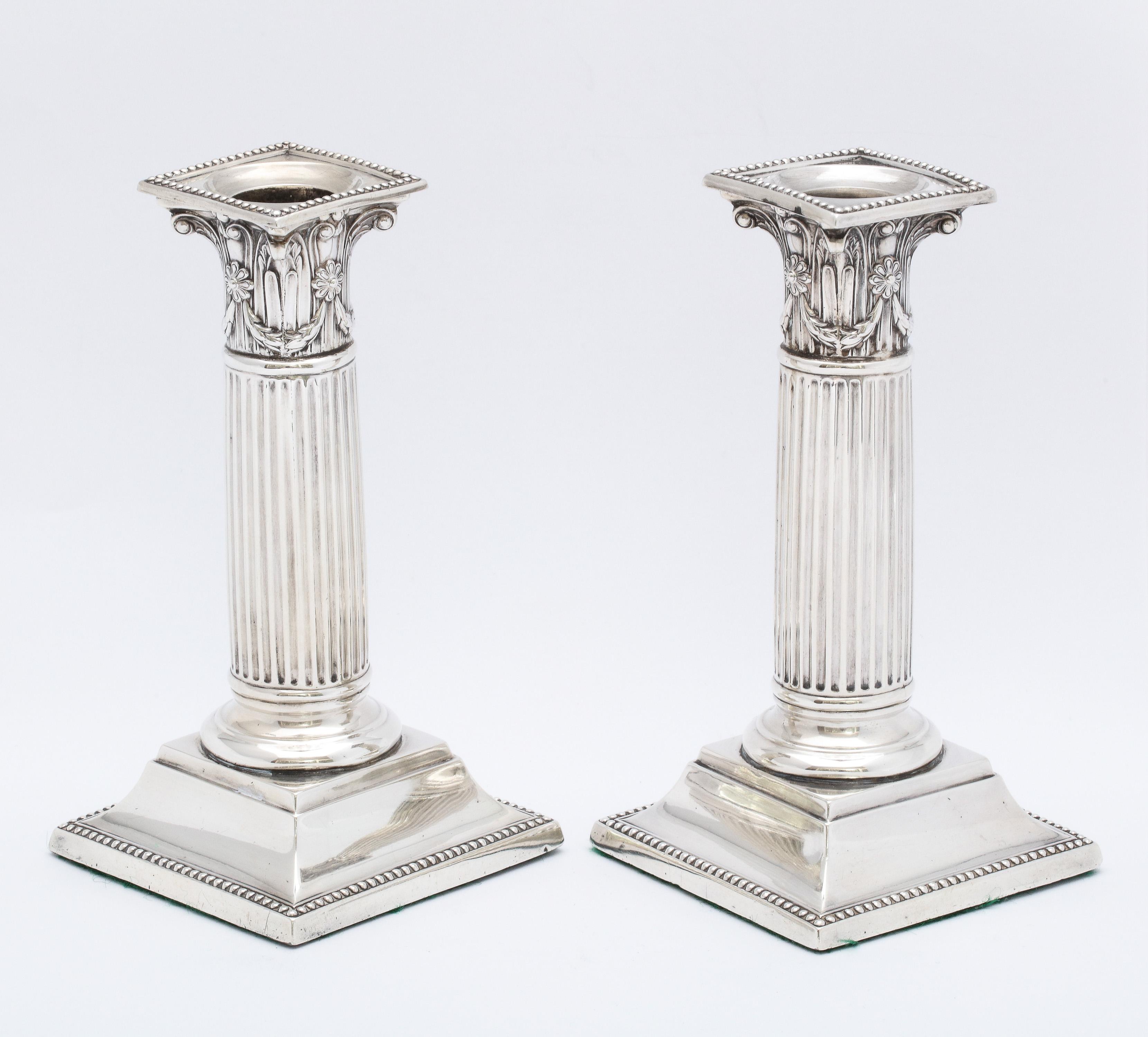 Late 19th Century Pair of Neoclassical Style Sterling Silver Corinthian Column Candlesticks For Sale