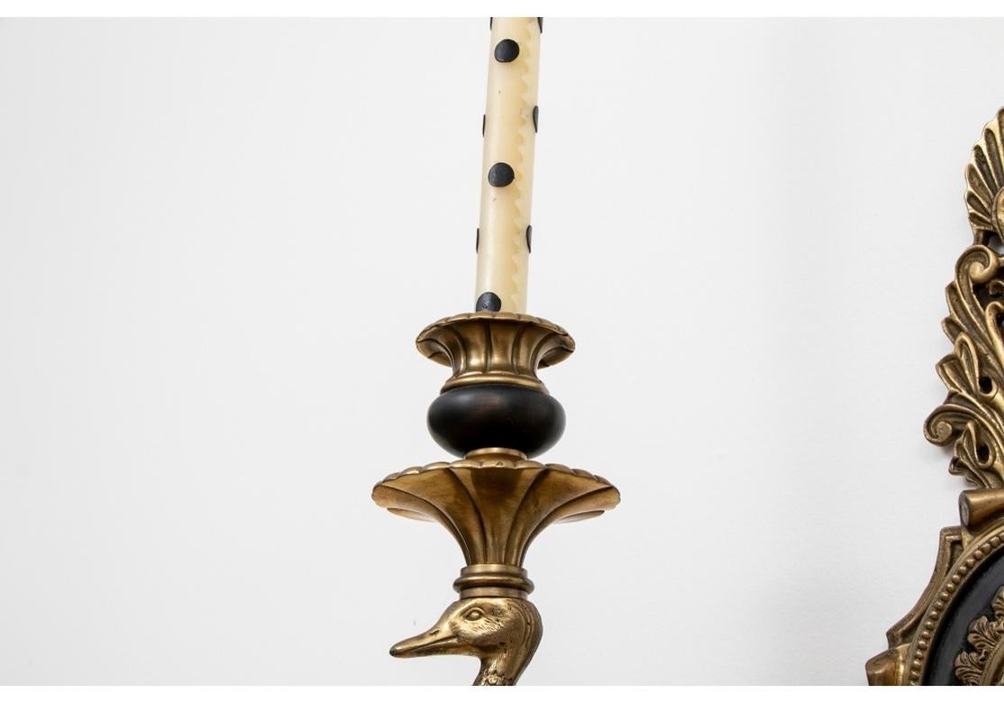 Highly decorative Swan Form Candle Sconces in all original condition. Ornate double arm candelabra sconces with urn form sockets and stylish swan supports. With acanthus leaf finials and terminals. 
18.5” h x 13” w x 8.25” d 
Condition: Very good