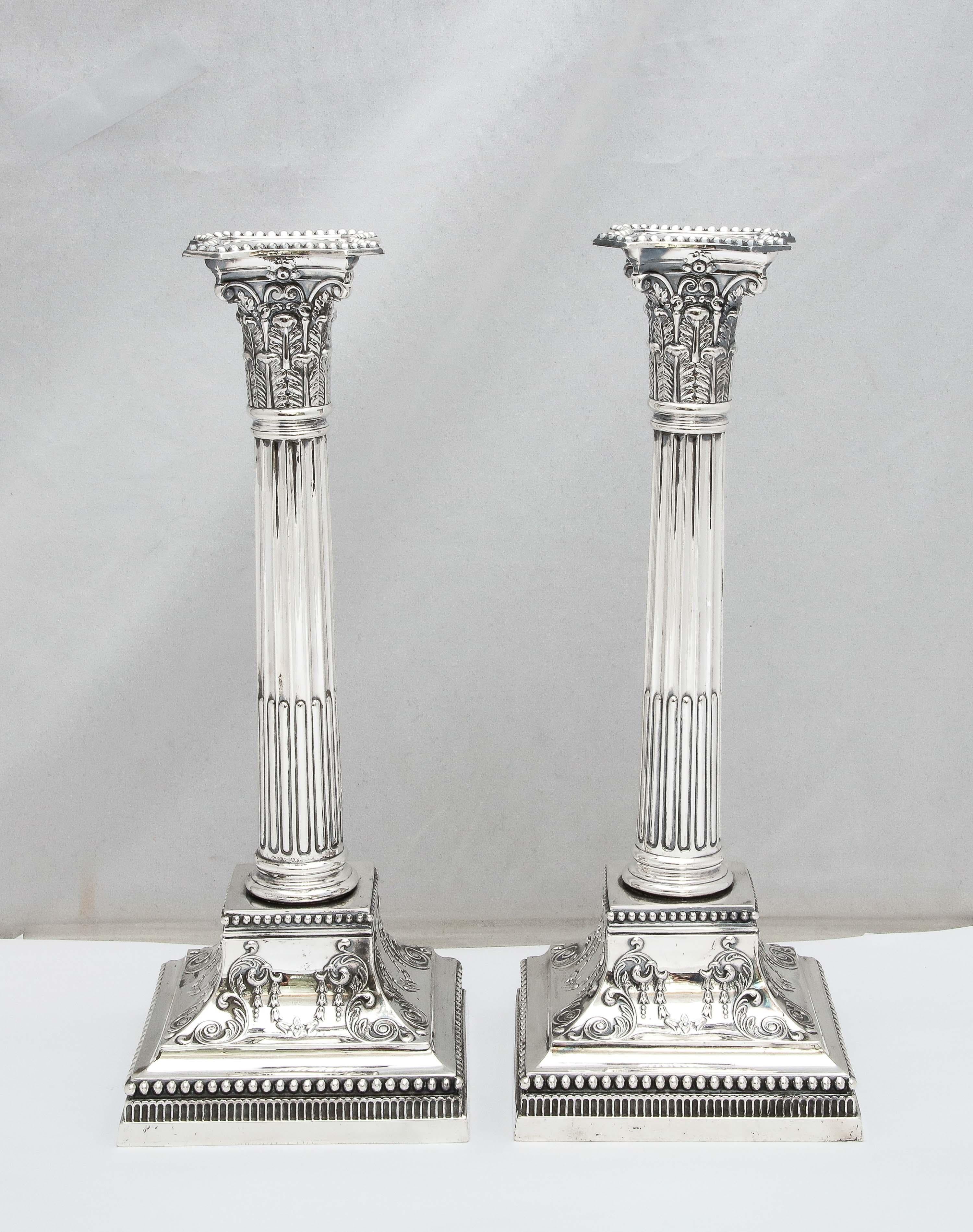 English Pair of Neoclassical-Style Tall Sterling Silver Corinthian Column Candlesticks For Sale