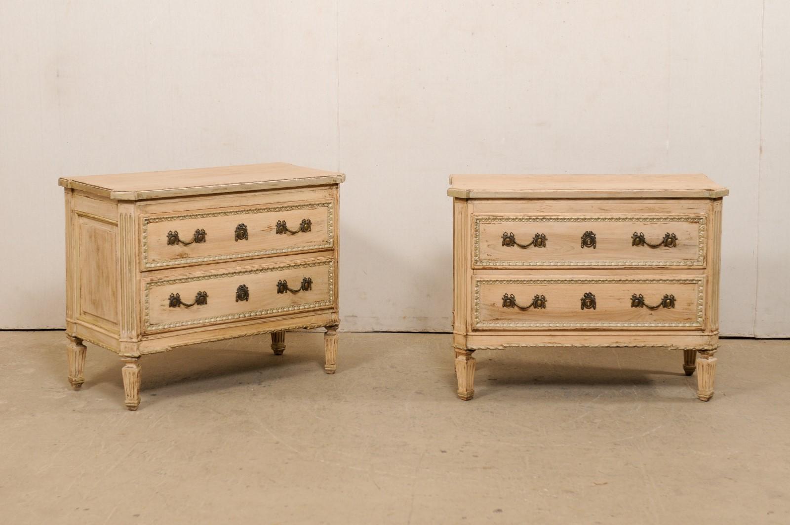 A vintage pair of nicely inspired French neoclassical style raised chests, American made by furniture makers Auffray & Co (NYC). This pair of French style commodes each feature rectangular-shaped tops with profiled corners, atop a case which houses
