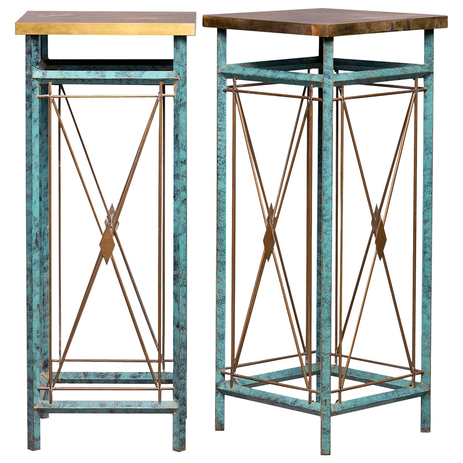Pair of tall metal statue or plant stands feature verde green legs with contrasting brass x-form cross pieces with diamond shaped centers and brass table tops, circa 1960s. Found in Italy. Unknown maker. Sold and priced as a pair.
