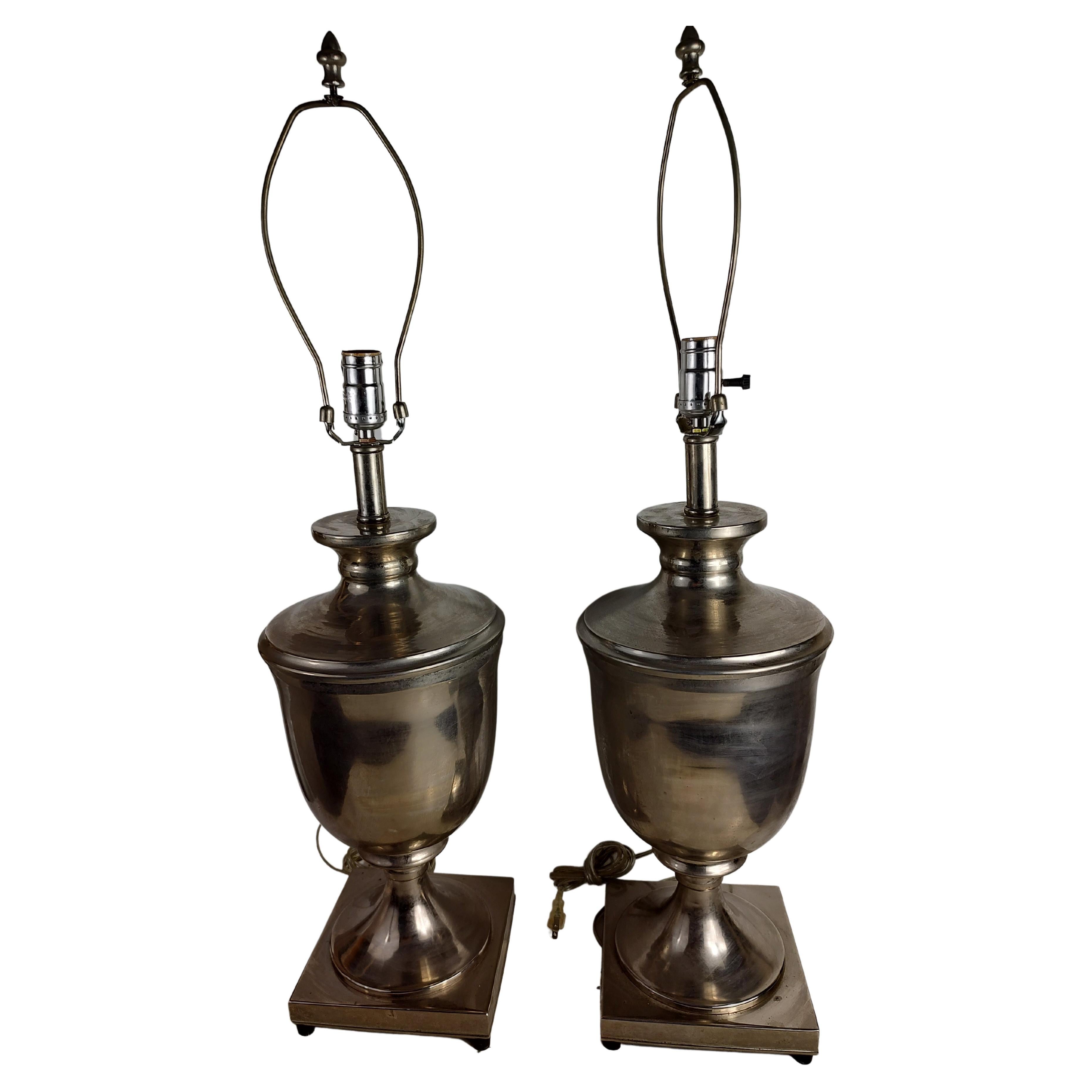 Simple and elegant pair of table lamps in the form of stainless steel urns. Regal in appearance, great size, not cumbersome. In excellent vintage condition with minimal wear. Wiring is sound. Hgt to top of socket is 24 inch, base is 7.25 x 7.25. 