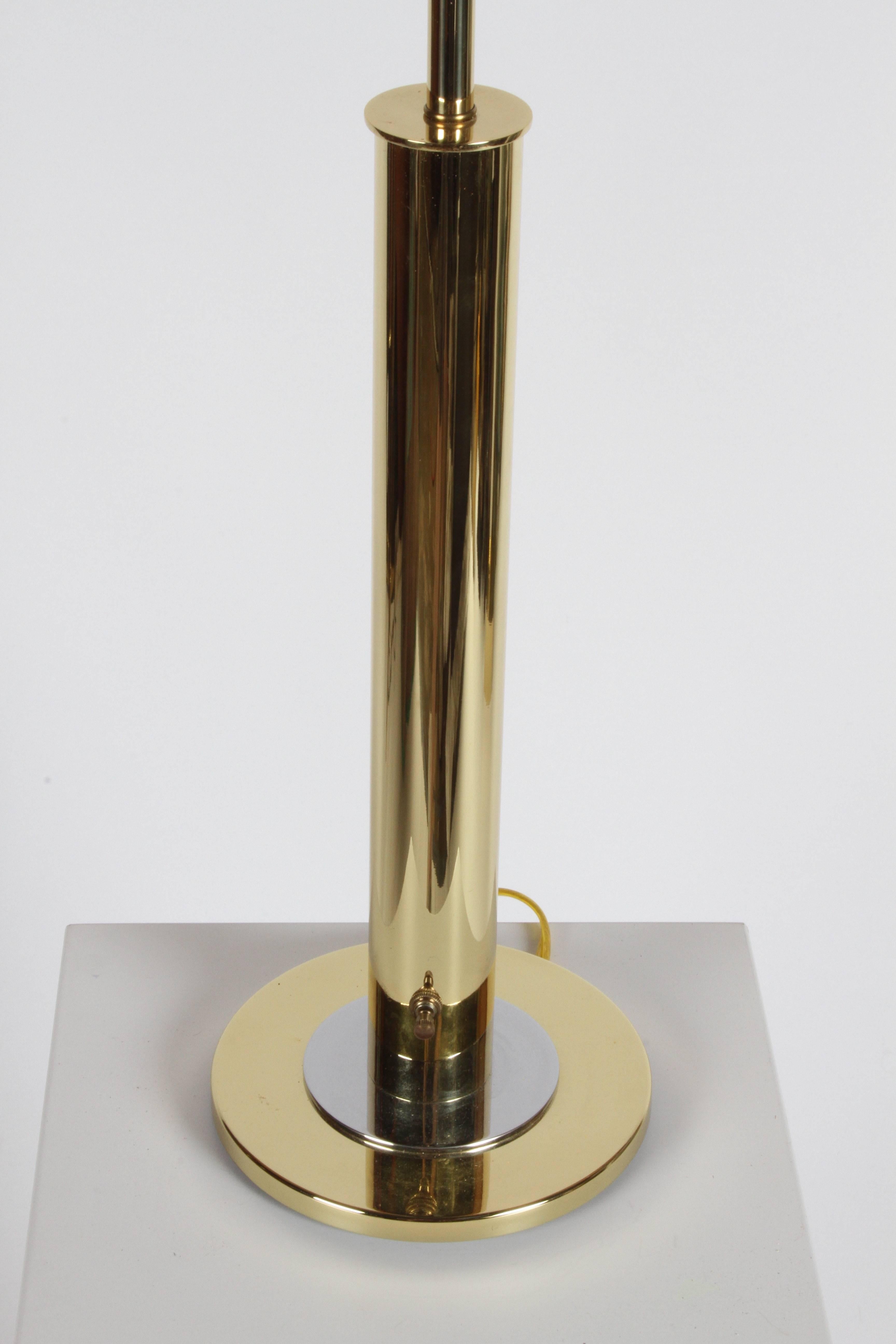Listed are a pair of Nessen NT754 polished brass with chrome disc. Shades are not original, (nice but not perfect), lamps are in very nice condition. Switch at bottom of lamp column, three-way bulb. Measures: Shades are diameter 16