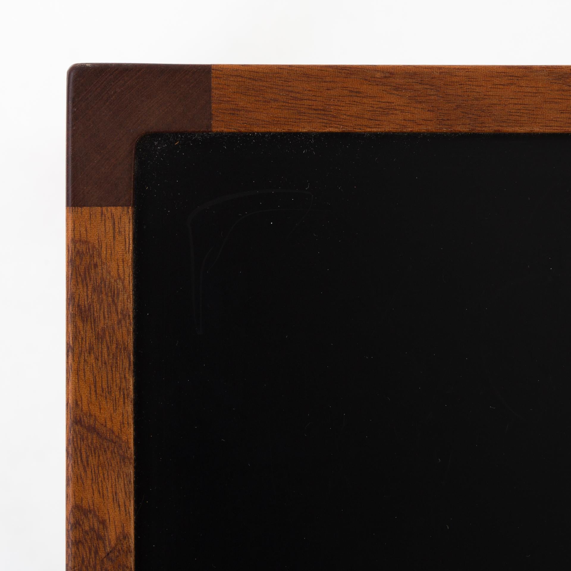 Nesting tables in mahogany and black Formica. Maker Rud. Rasmussen.